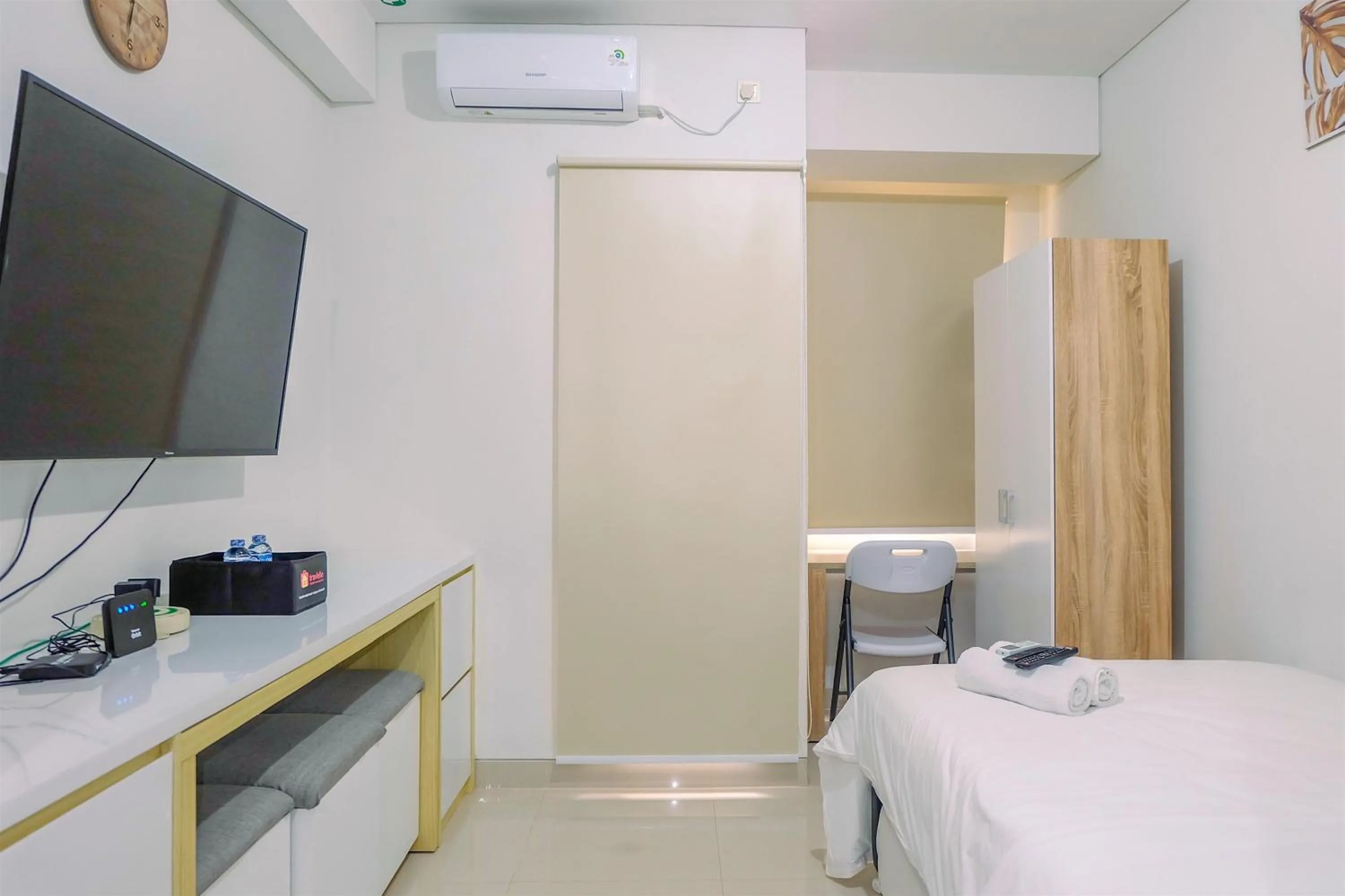 Bed in Simply and Homey Studio Transpark Cibubur Apartment By Travelio