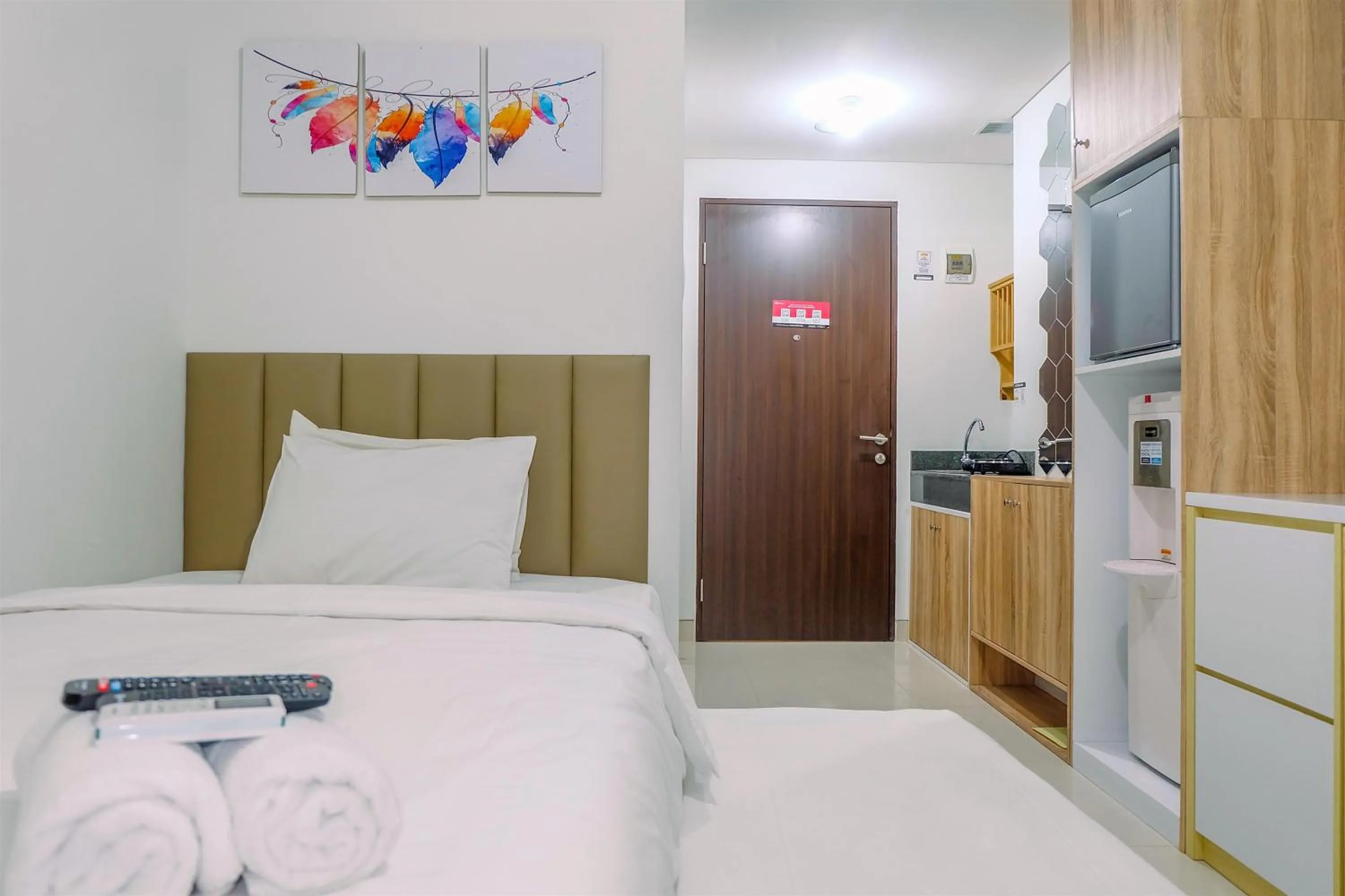 Bed in Simply and Homey Studio Transpark Cibubur Apartment By Travelio