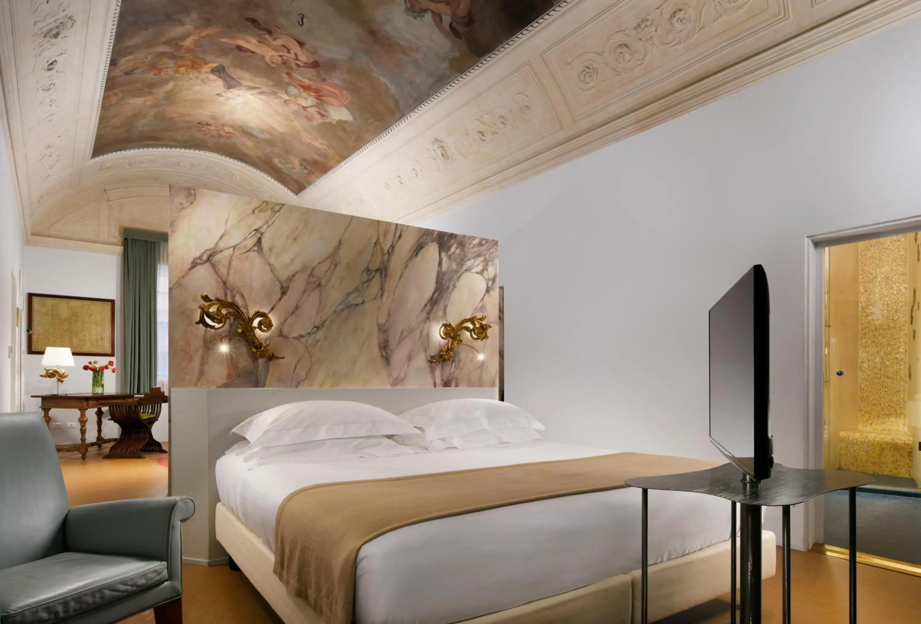 Bedroom, Bed in Leone Blu Suites | UNA Esperienze