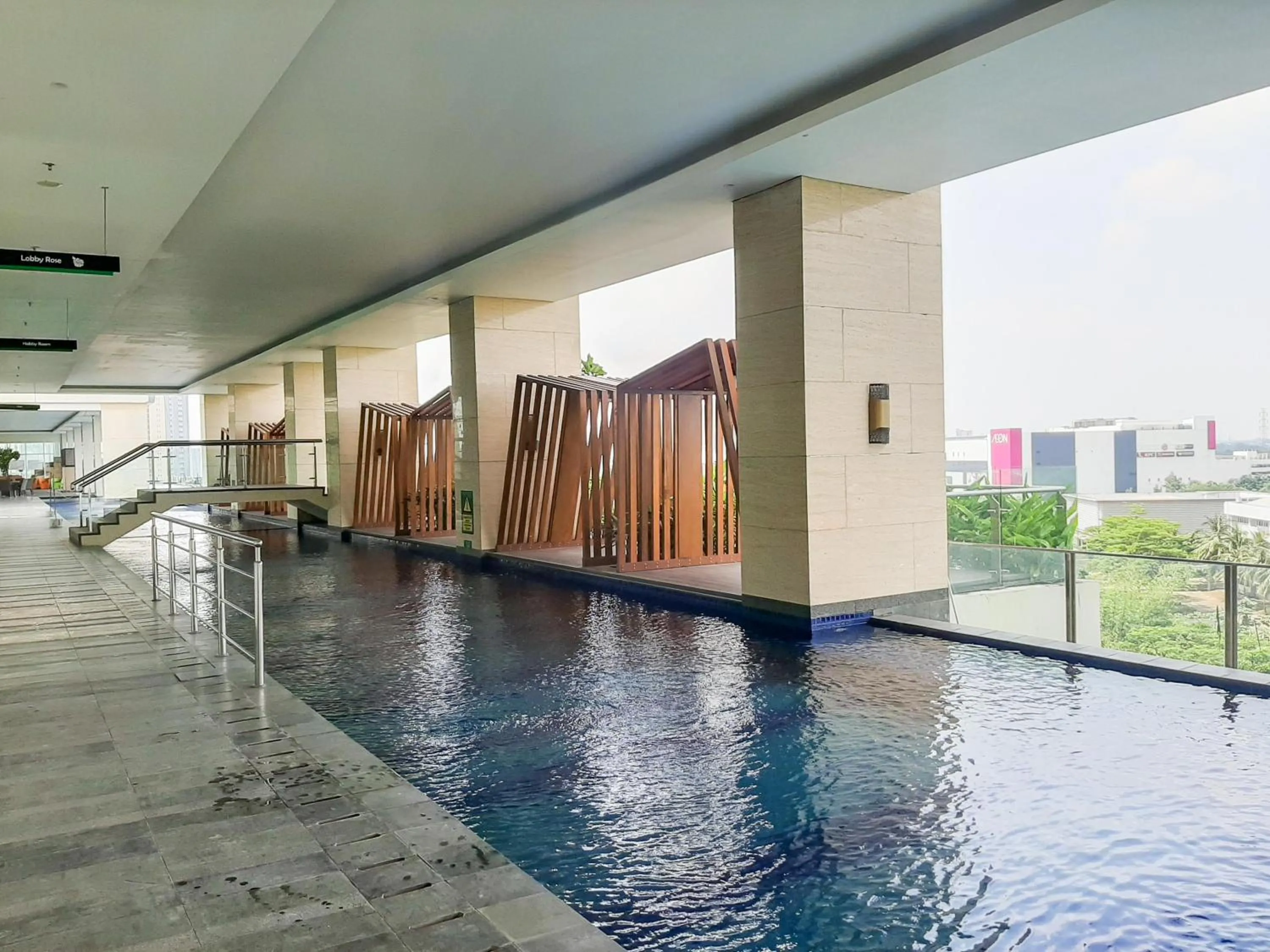 Swimming pool in Cozy and Nice Studio at Apartment B Residence By Travelio