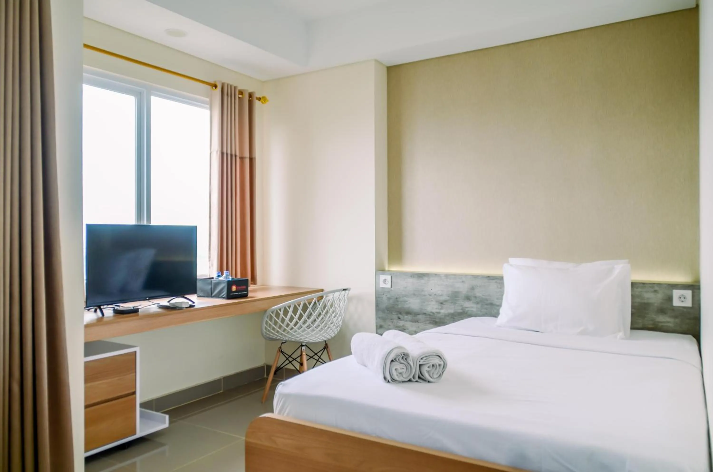 Bed in Cozy and Nice Studio at Apartment B Residence By Travelio