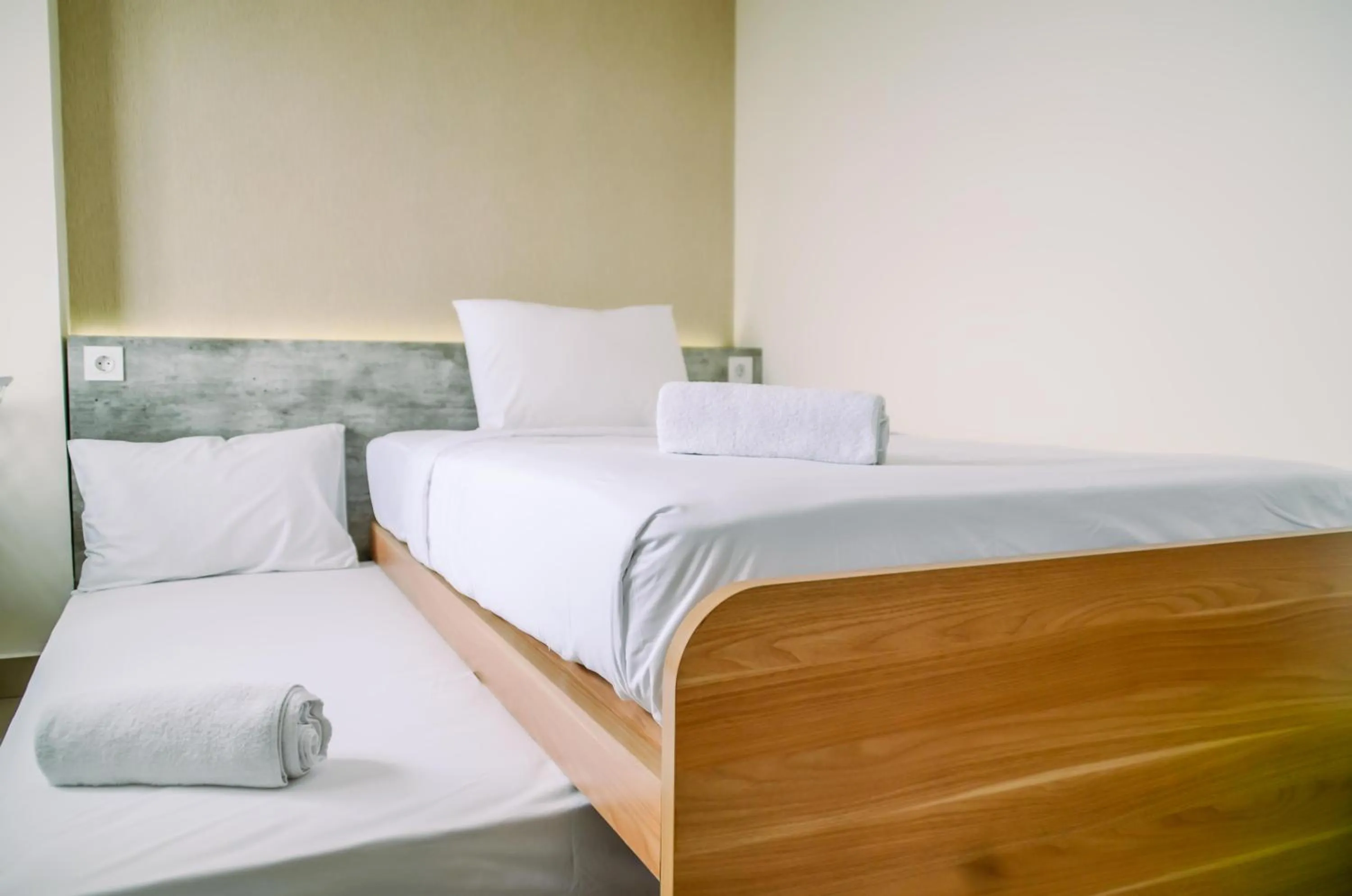 Bed in Cozy and Nice Studio at Apartment B Residence By Travelio