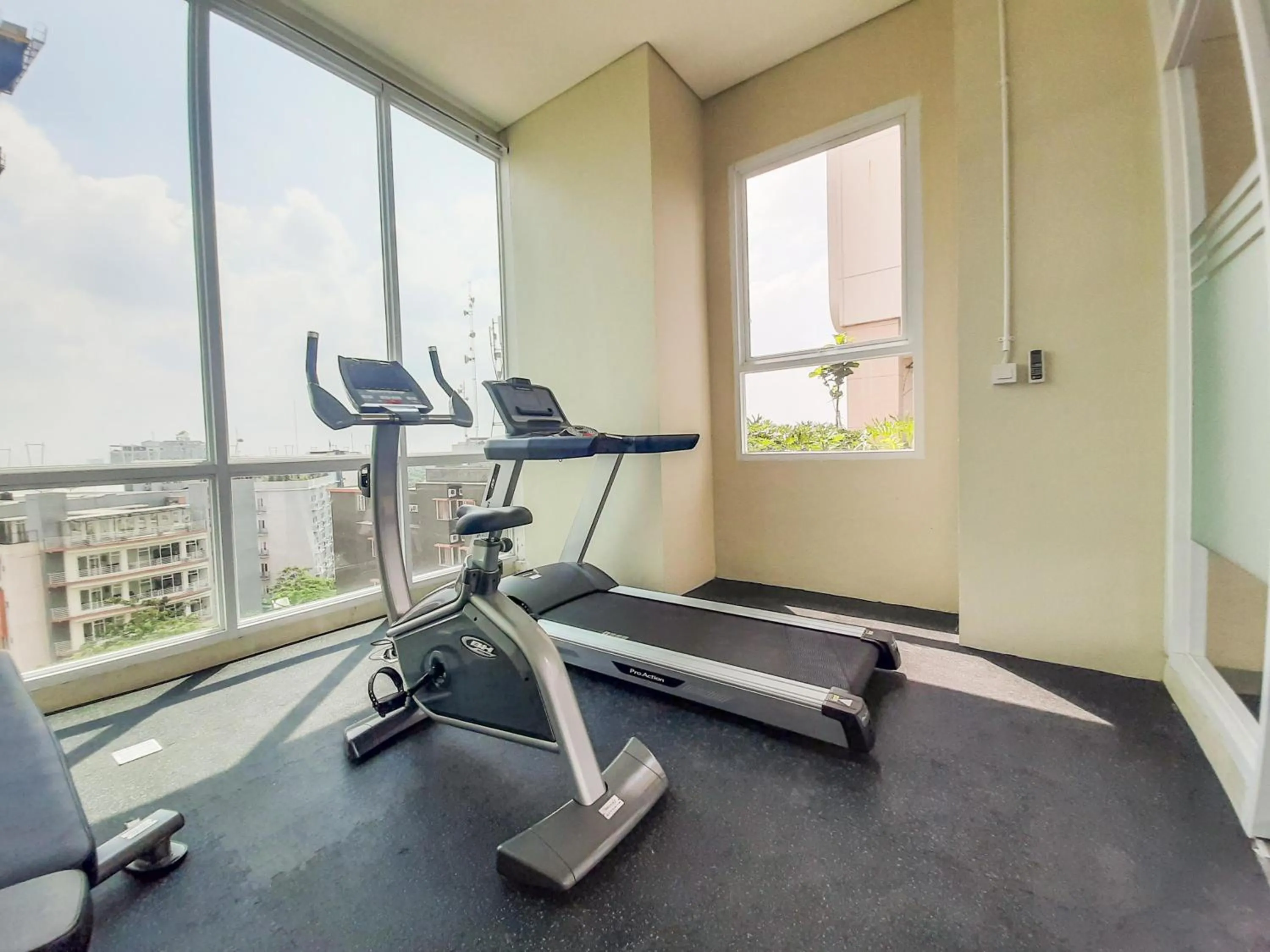 Fitness centre/facilities in Cozy and Nice Studio at Apartment B Residence By Travelio