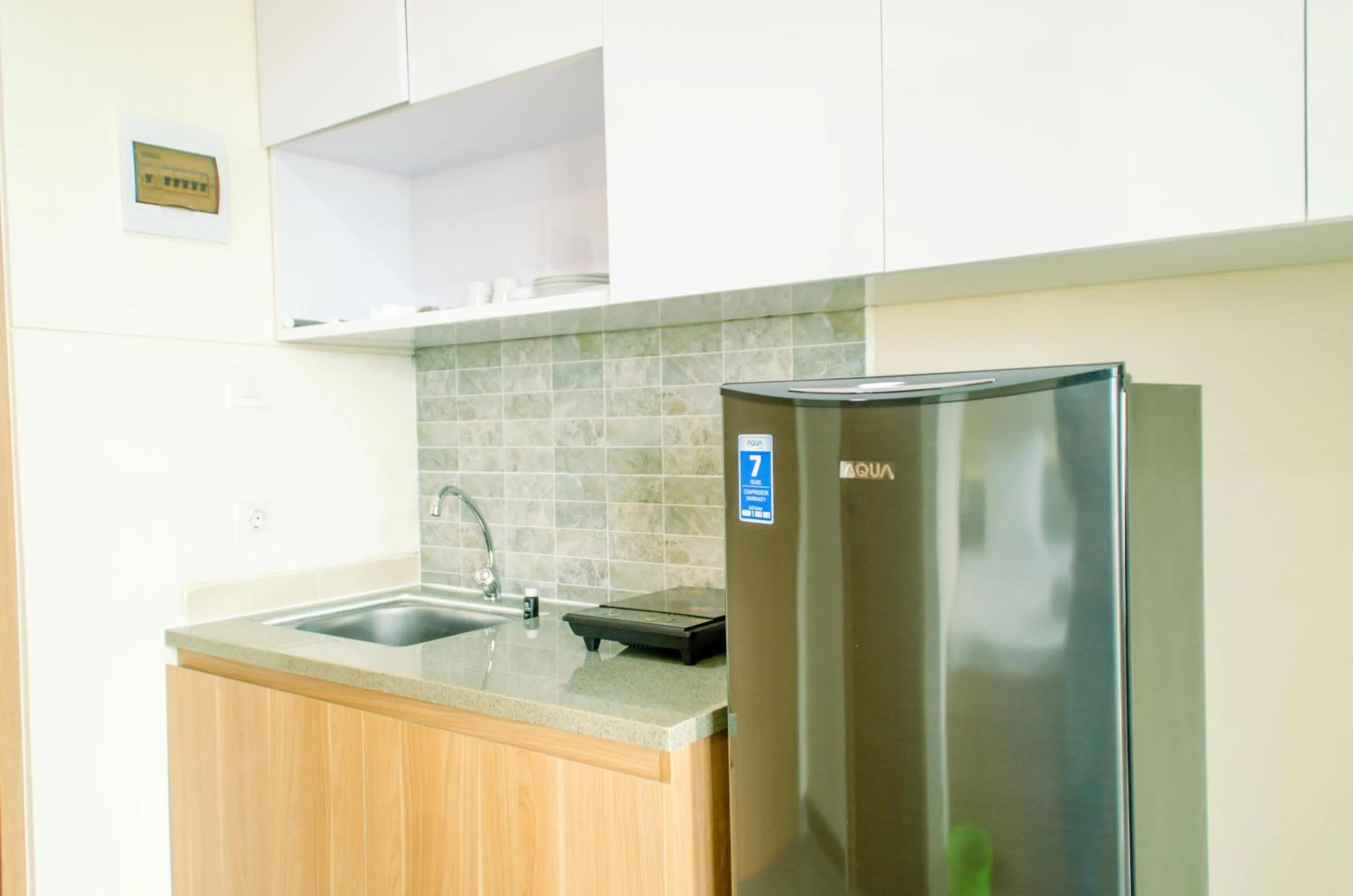 Kitchen or kitchenette in Cozy and Nice Studio at Apartment B Residence By Travelio