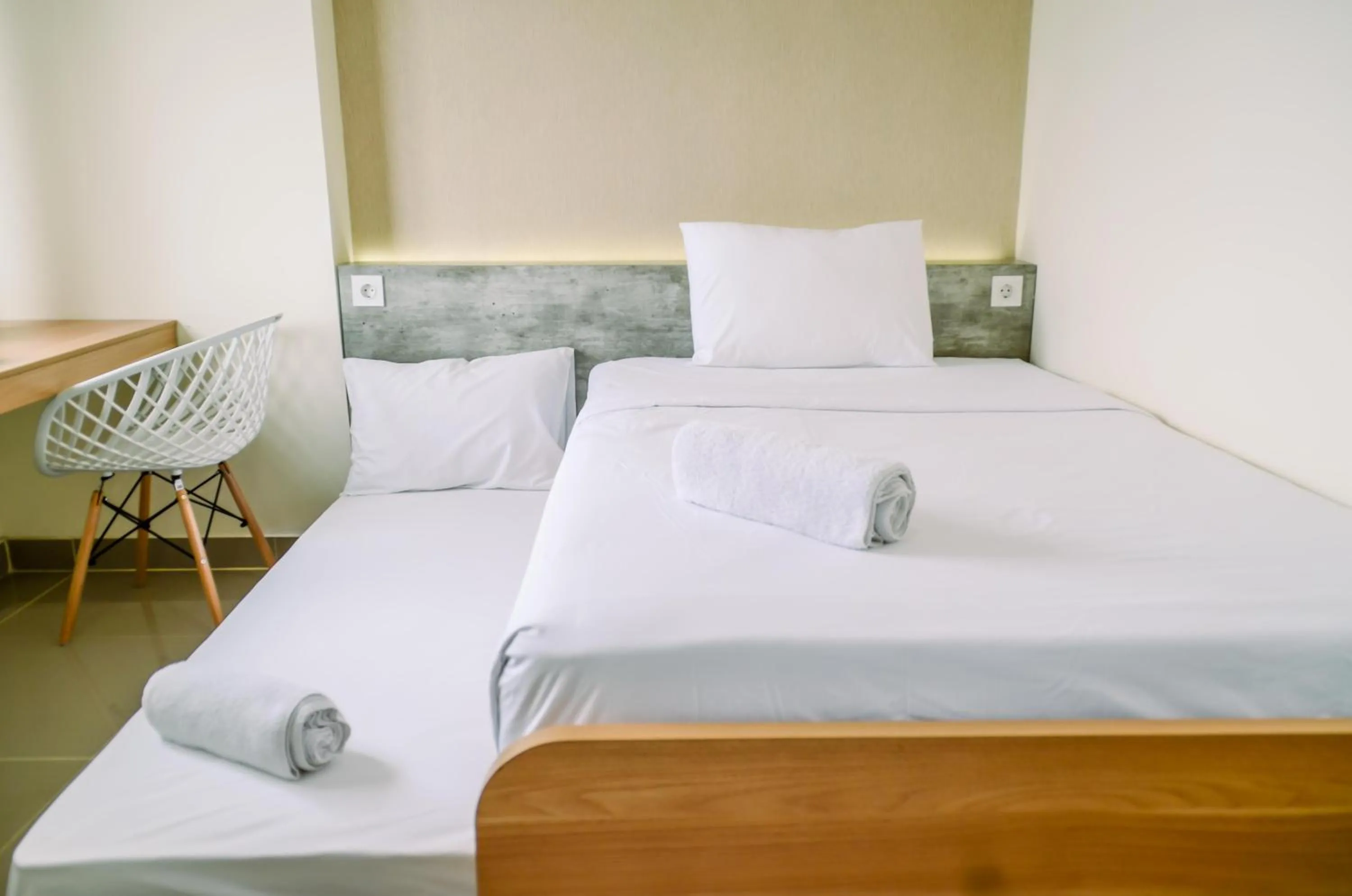 Bed in Cozy and Nice Studio at Apartment B Residence By Travelio