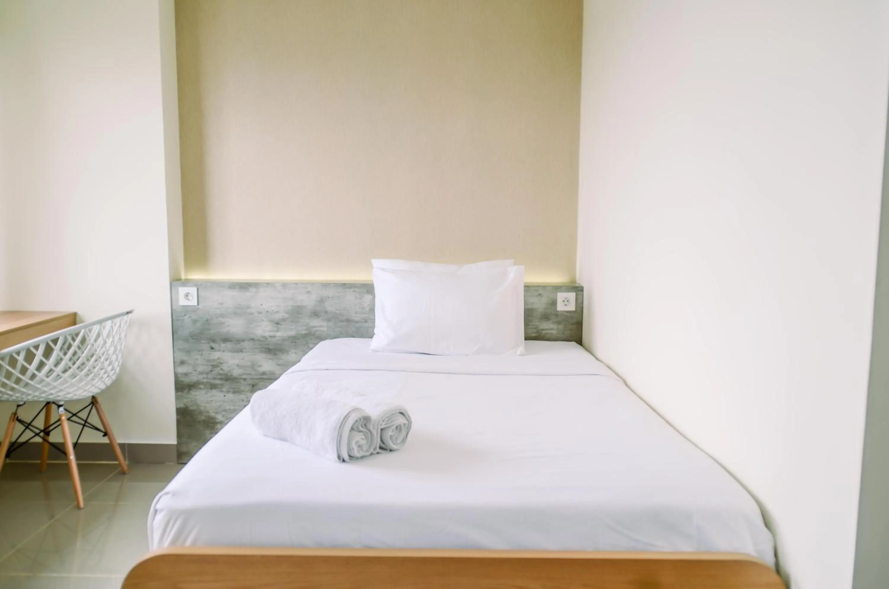 Bed in Cozy and Nice Studio at Apartment B Residence By Travelio