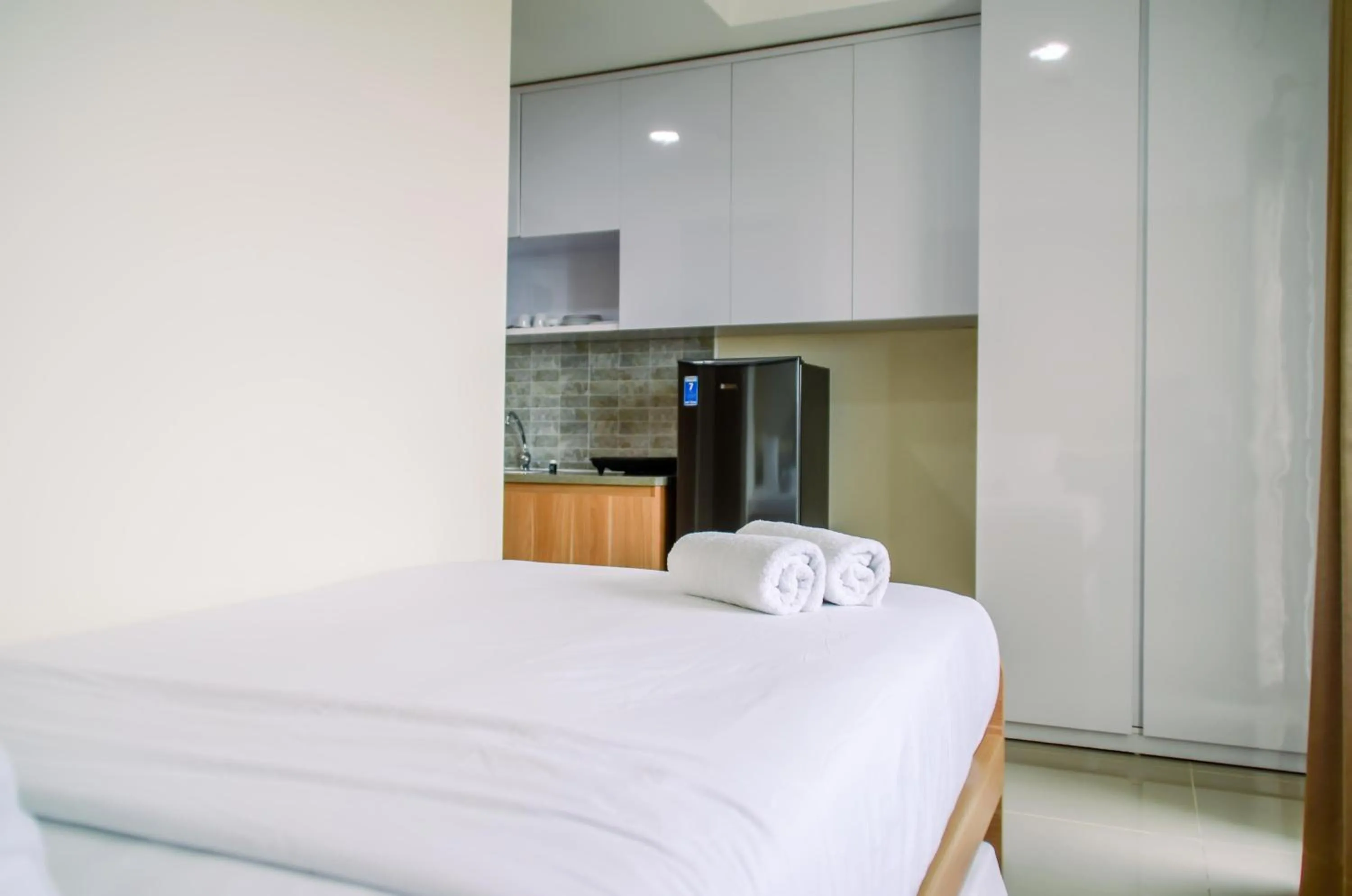 Bed in Cozy and Nice Studio at Apartment B Residence By Travelio