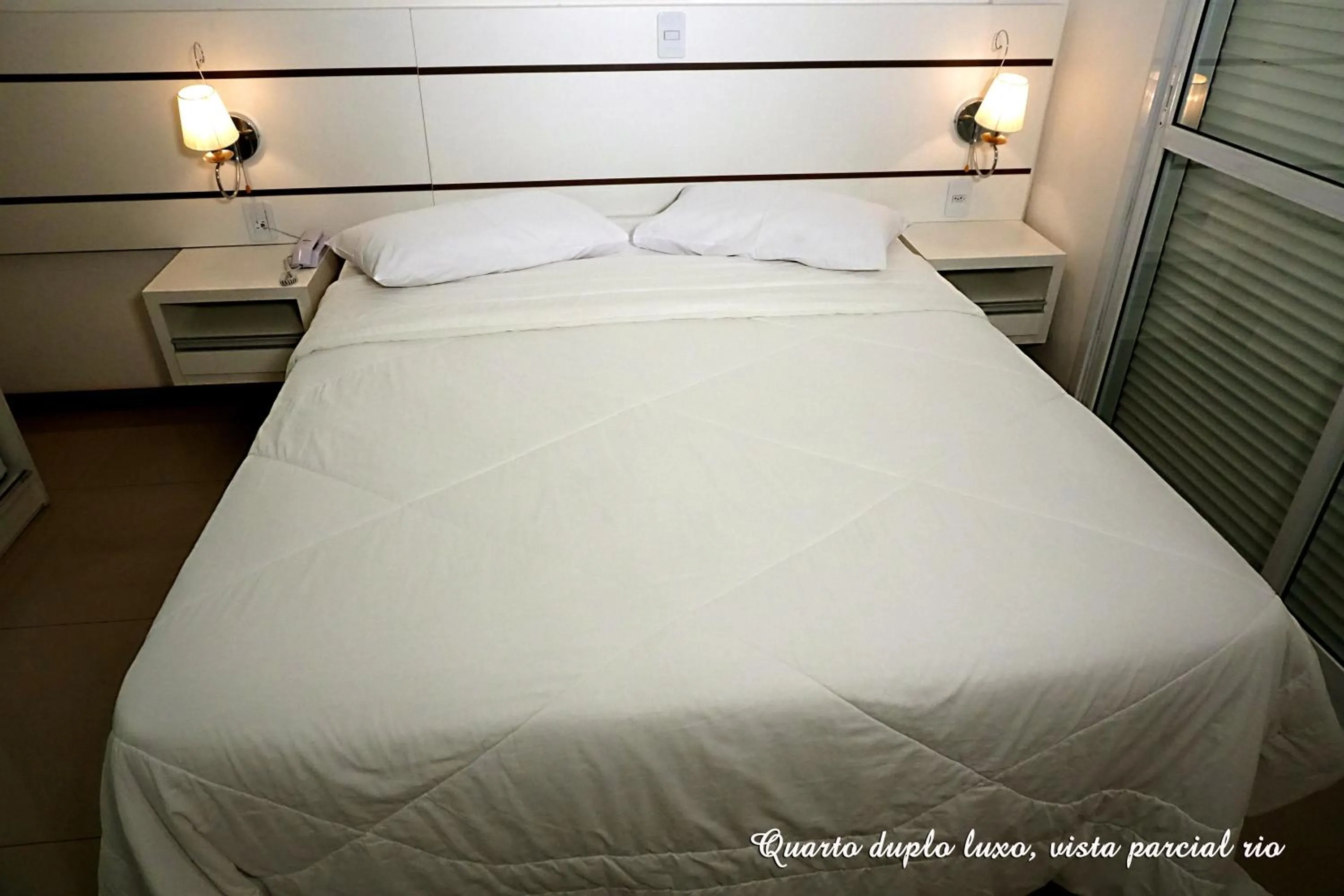 Bed in Pousada Molhes da Barra