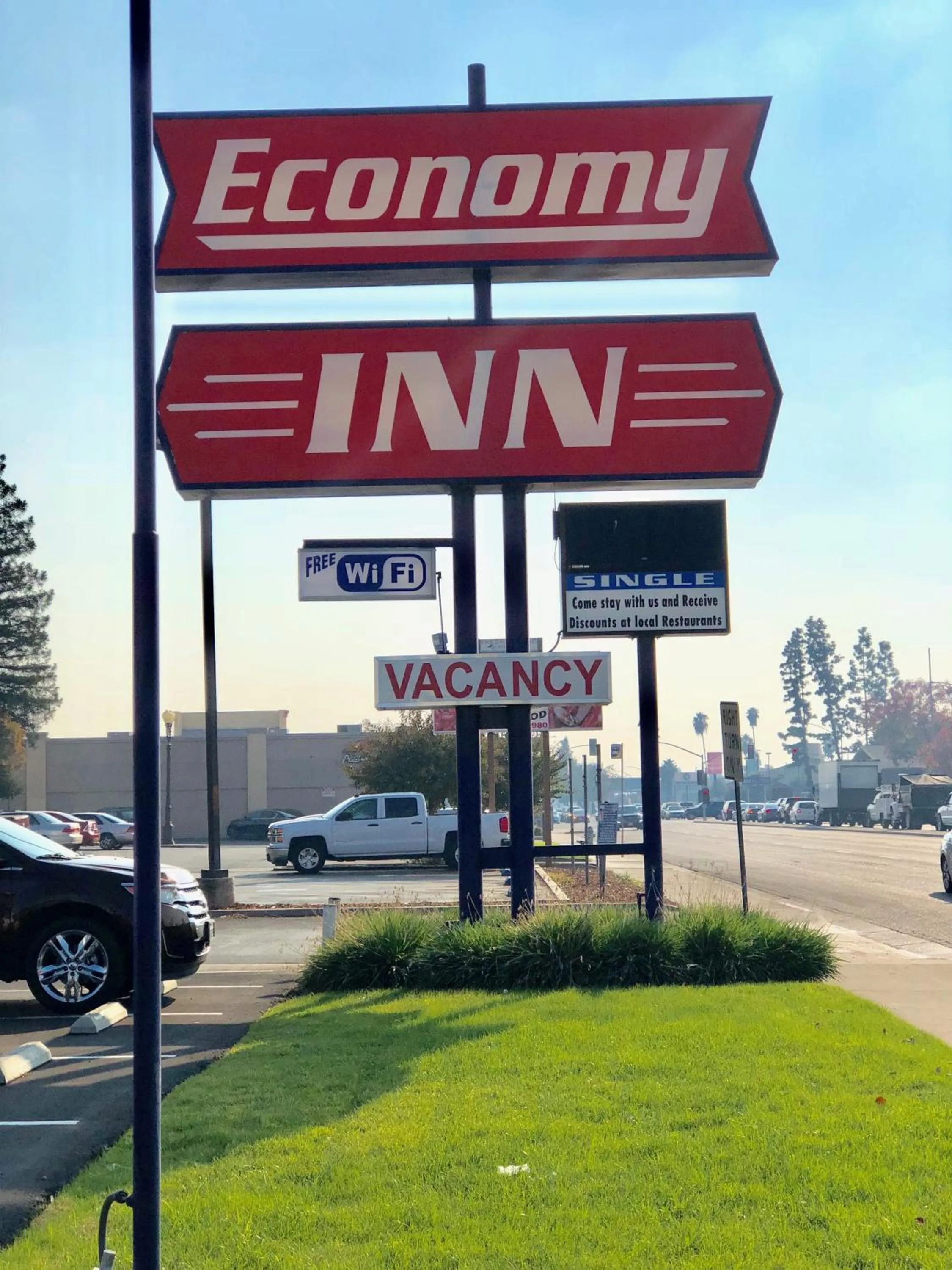 Property logo or sign in Economy Inn Fresno Yosemite