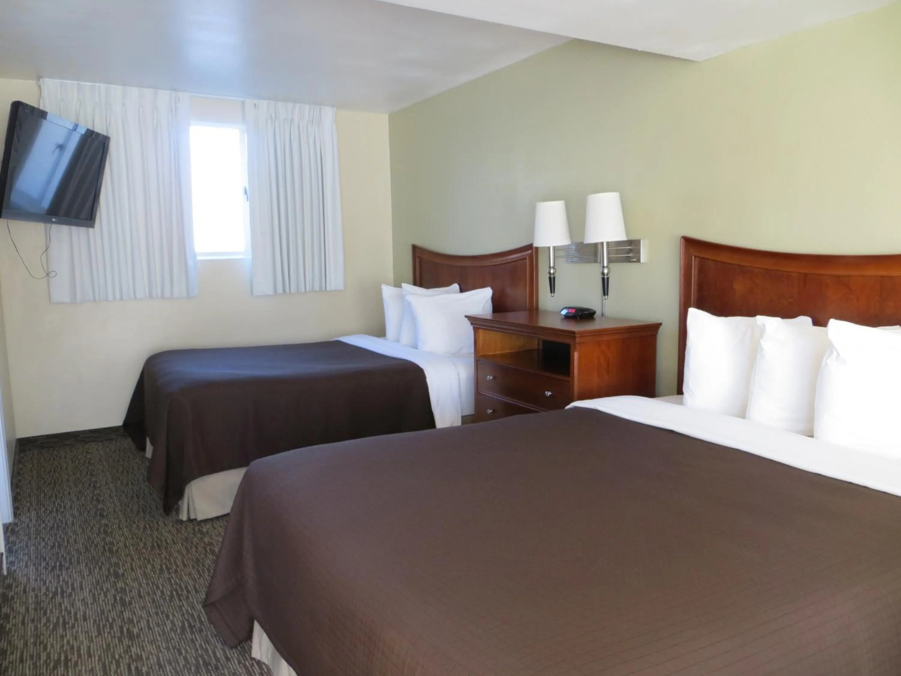 Bed in Coronet Motel