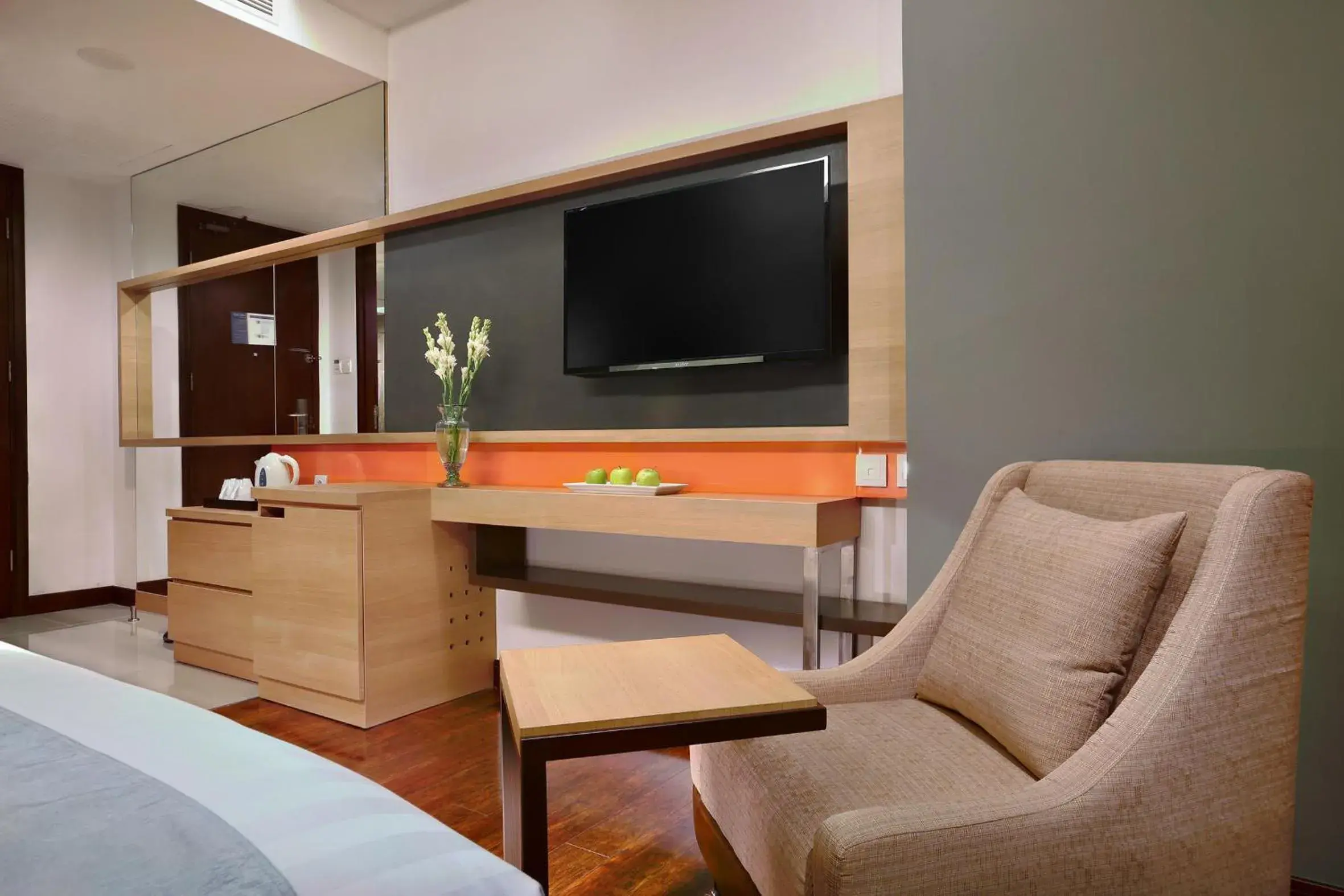 Living room, Bed in Harper Malioboro Yogyakarta by ASTON Living room, Bed in Harper Malioboro Yogyakarta by ASTON