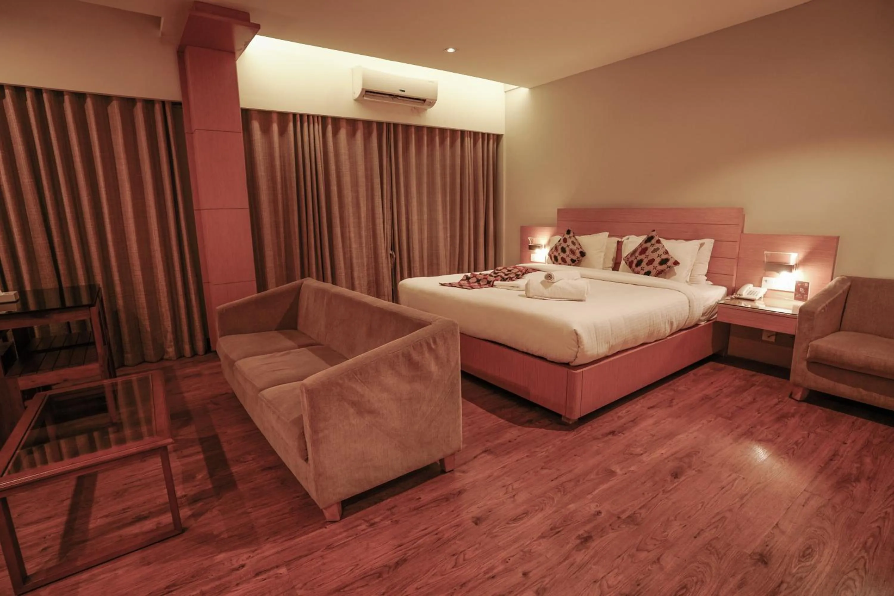 Bed in Hotel Indriya Wayanad