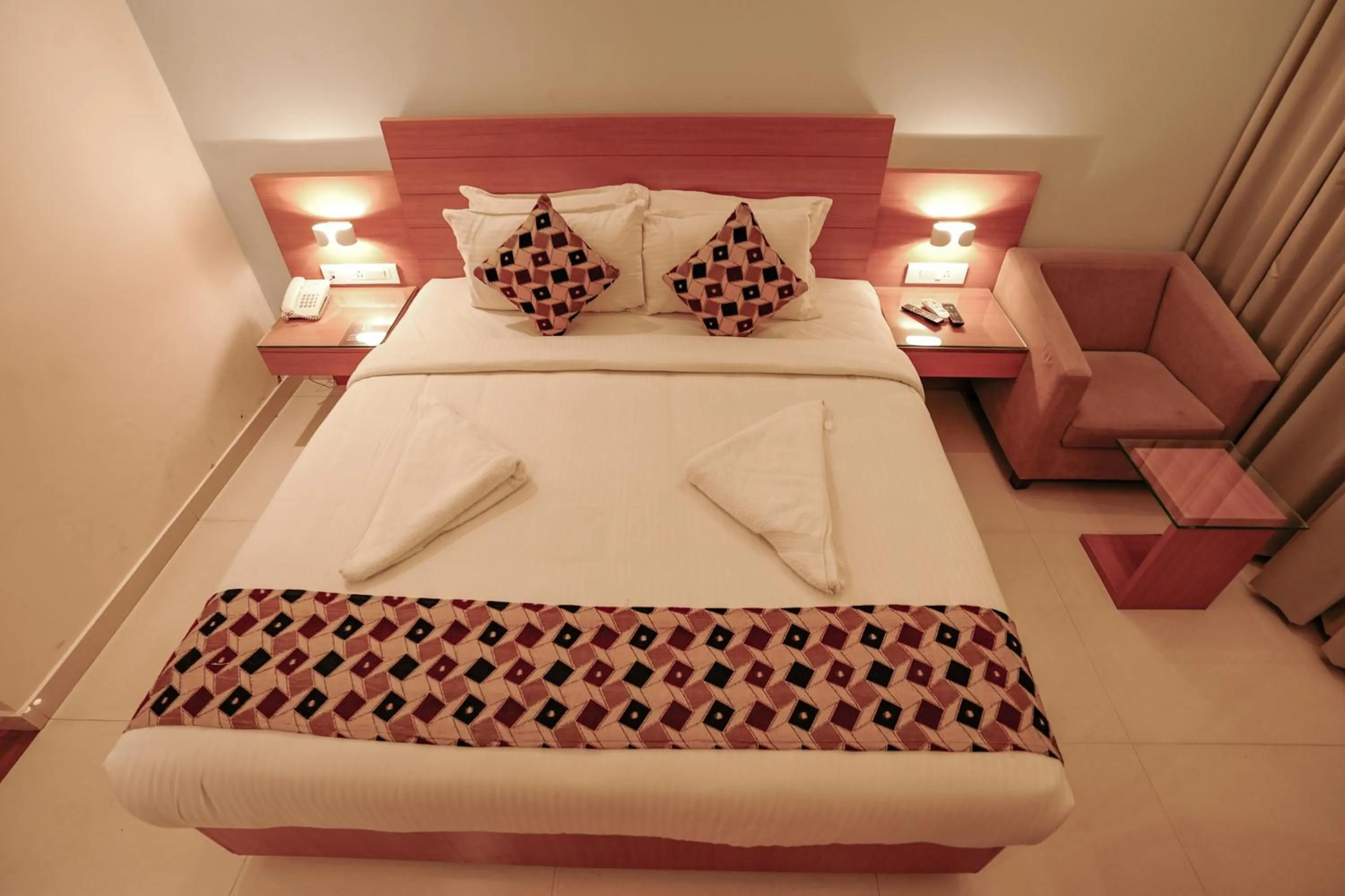Bed in Hotel Indriya Wayanad