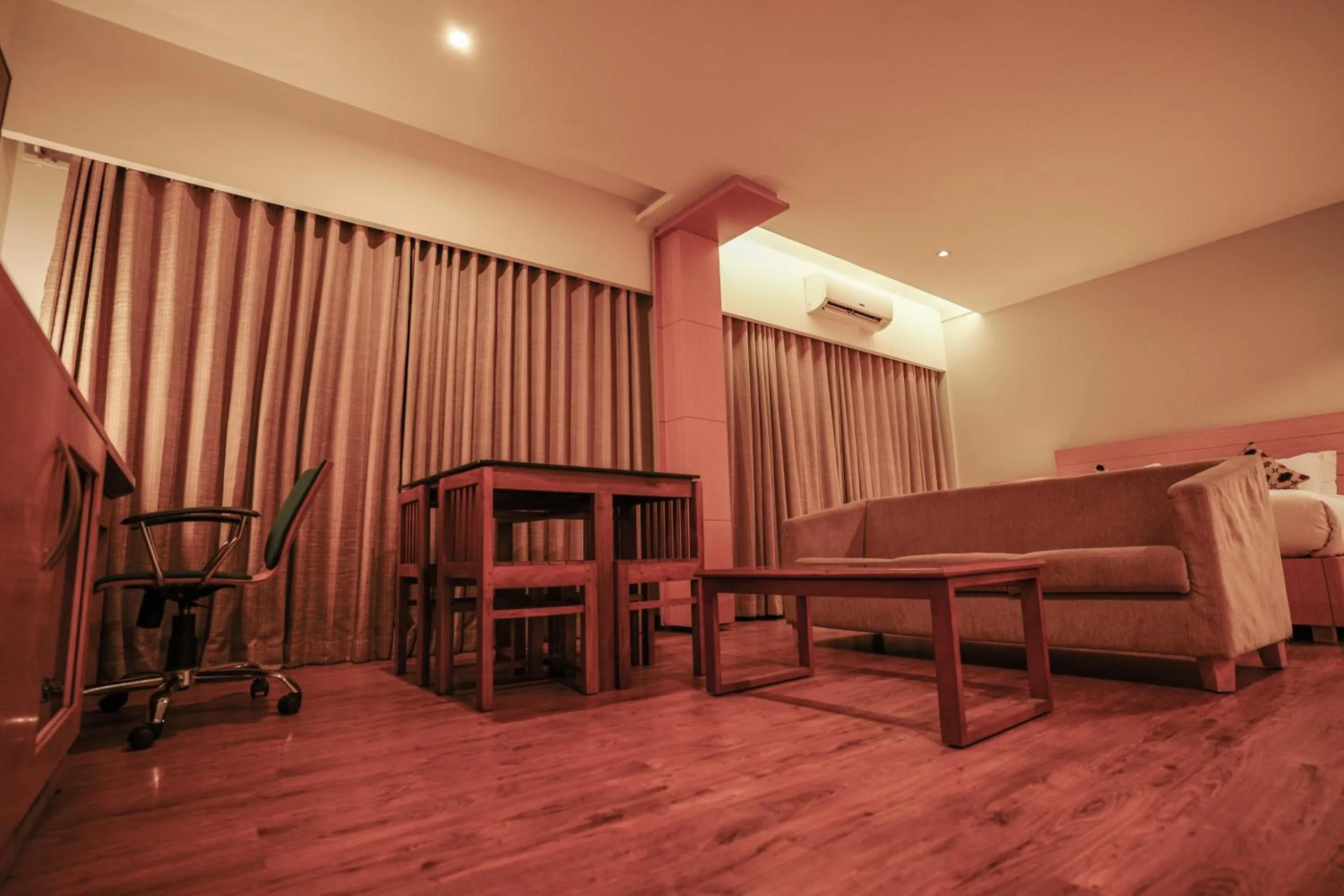 Bed in Hotel Indriya Wayanad