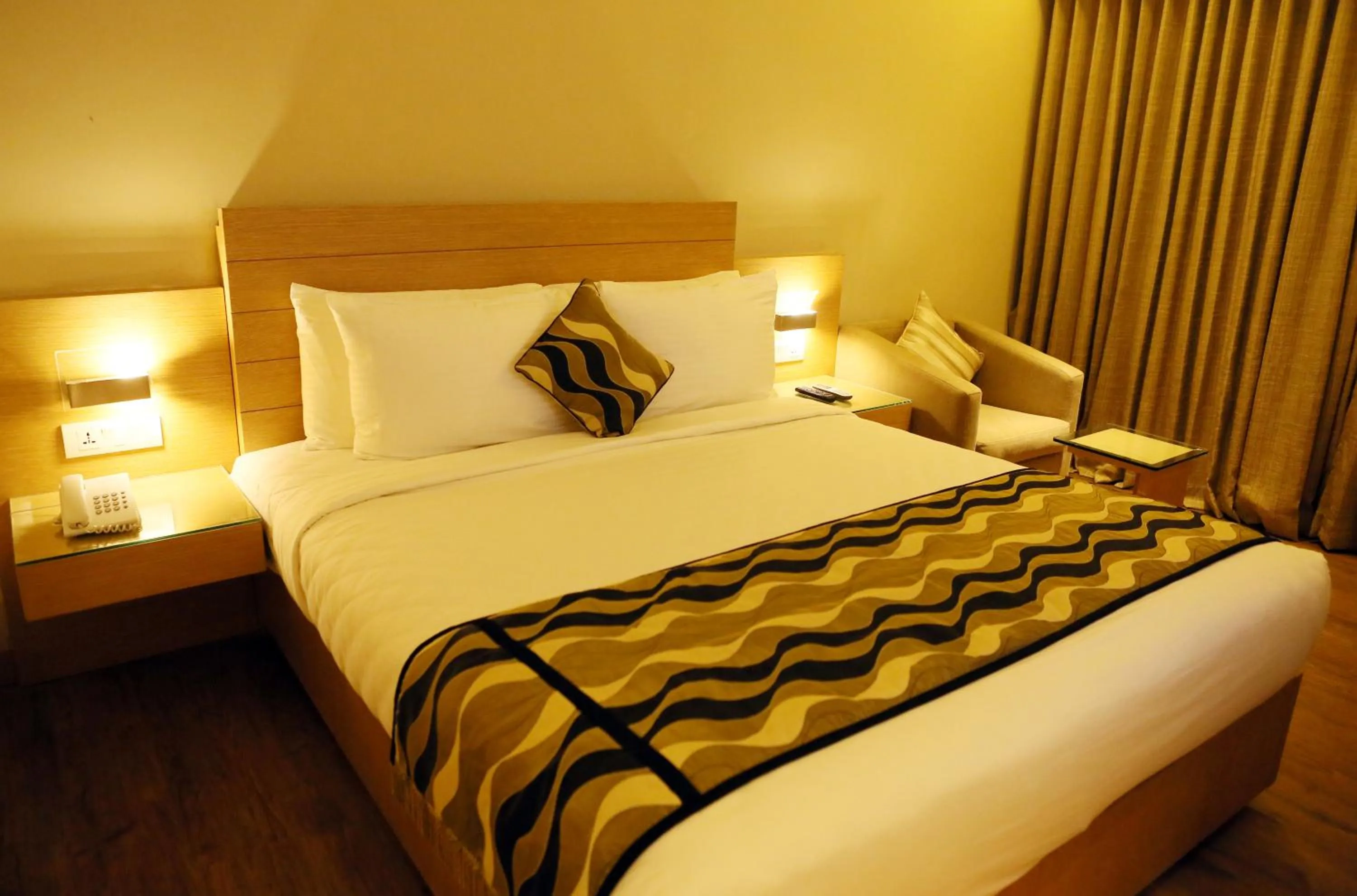 Bed in Hotel Indriya Wayanad