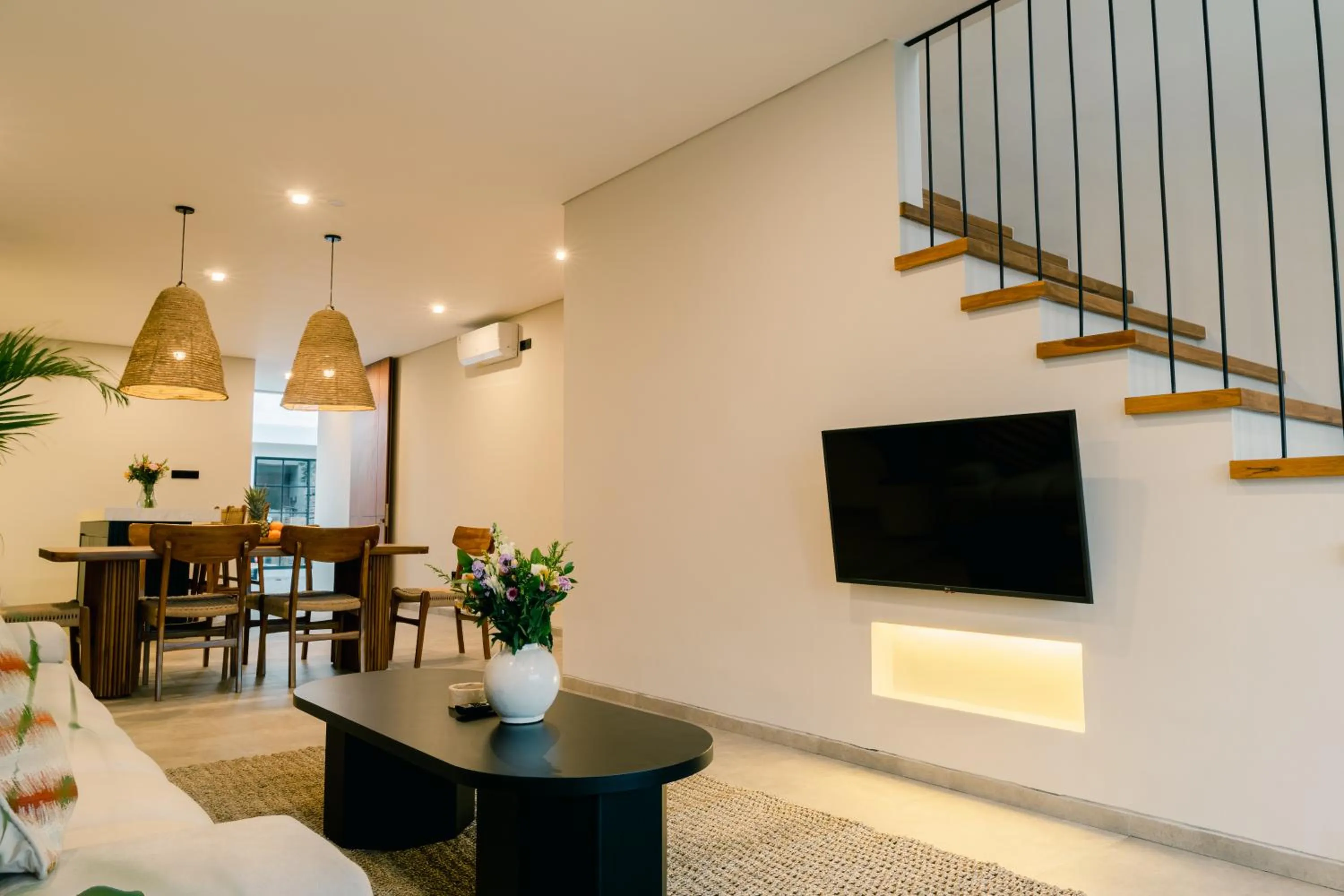 Communal lounge/ TV room in The Menuai Bali Villas Canggu