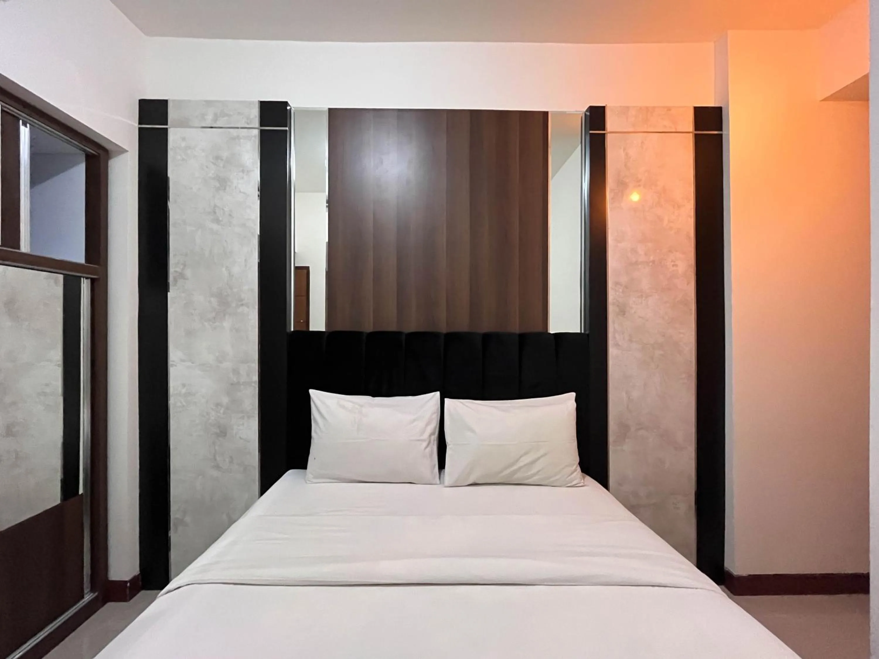 Bed in Warm and Cozy 2BR Vida View Makassar Apartment By Travelio