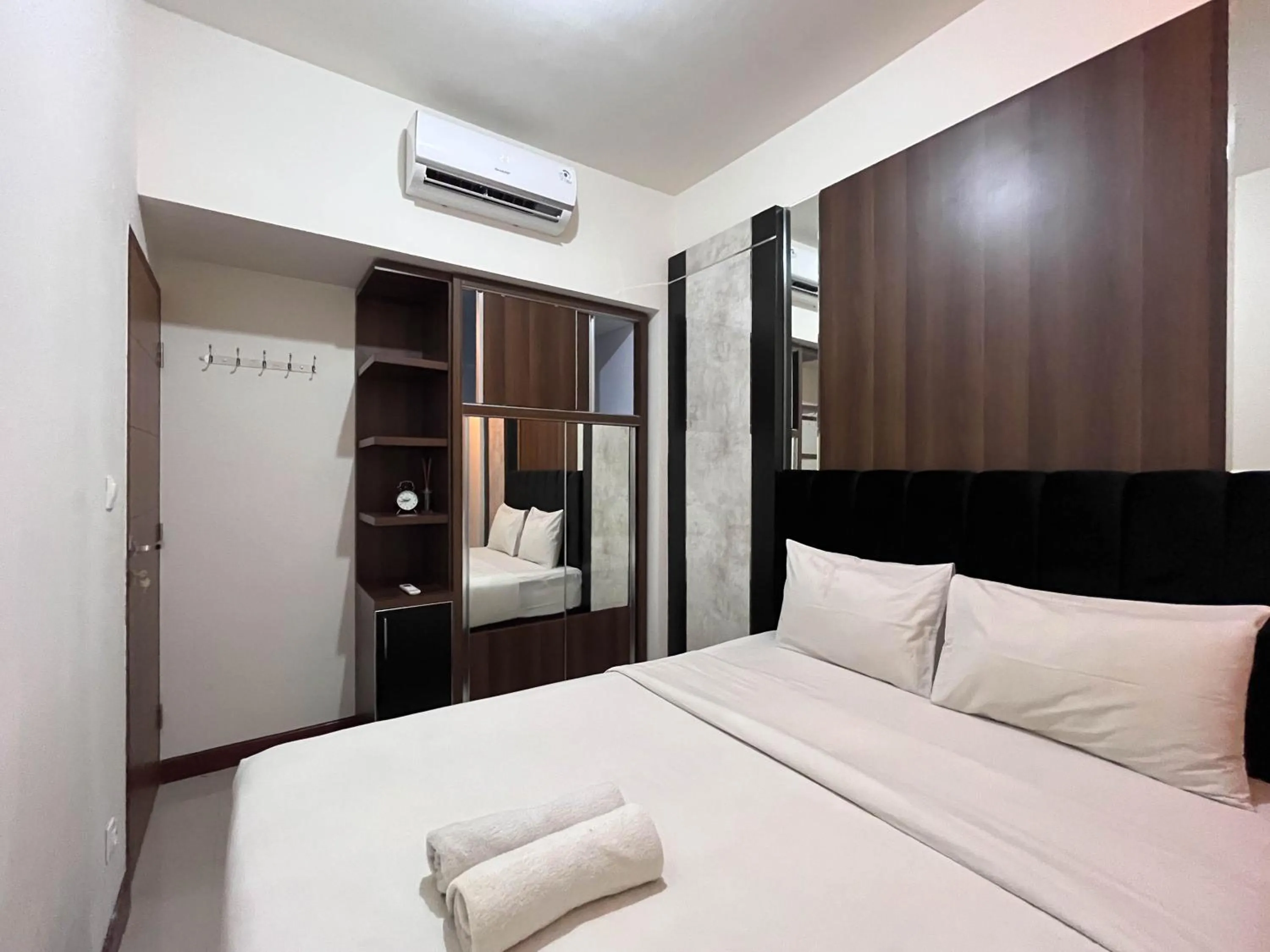 Bed in Warm and Cozy 2BR Vida View Makassar Apartment By Travelio