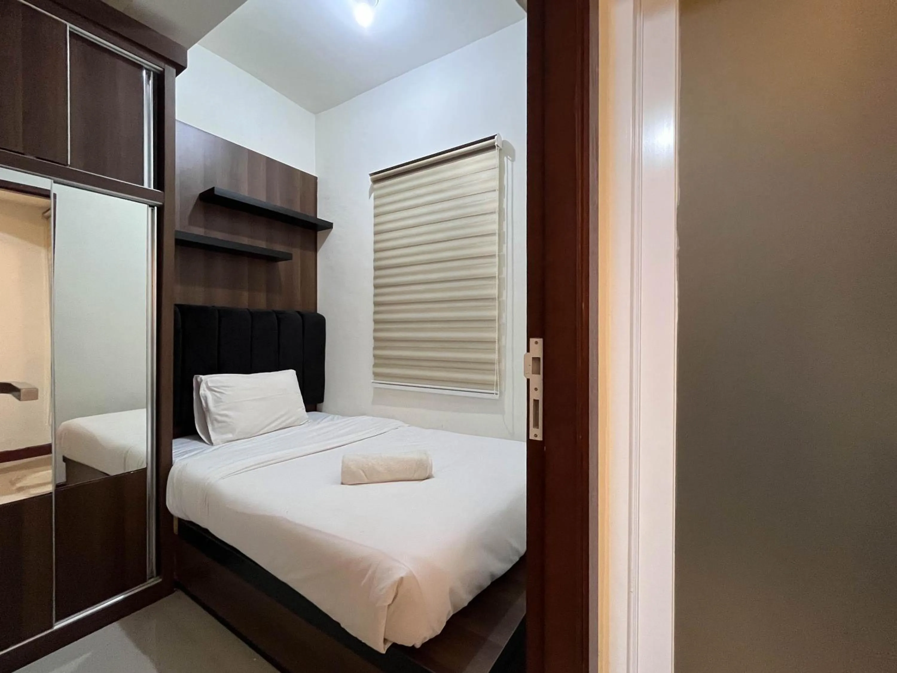 Bed in Warm and Cozy 2BR Vida View Makassar Apartment By Travelio