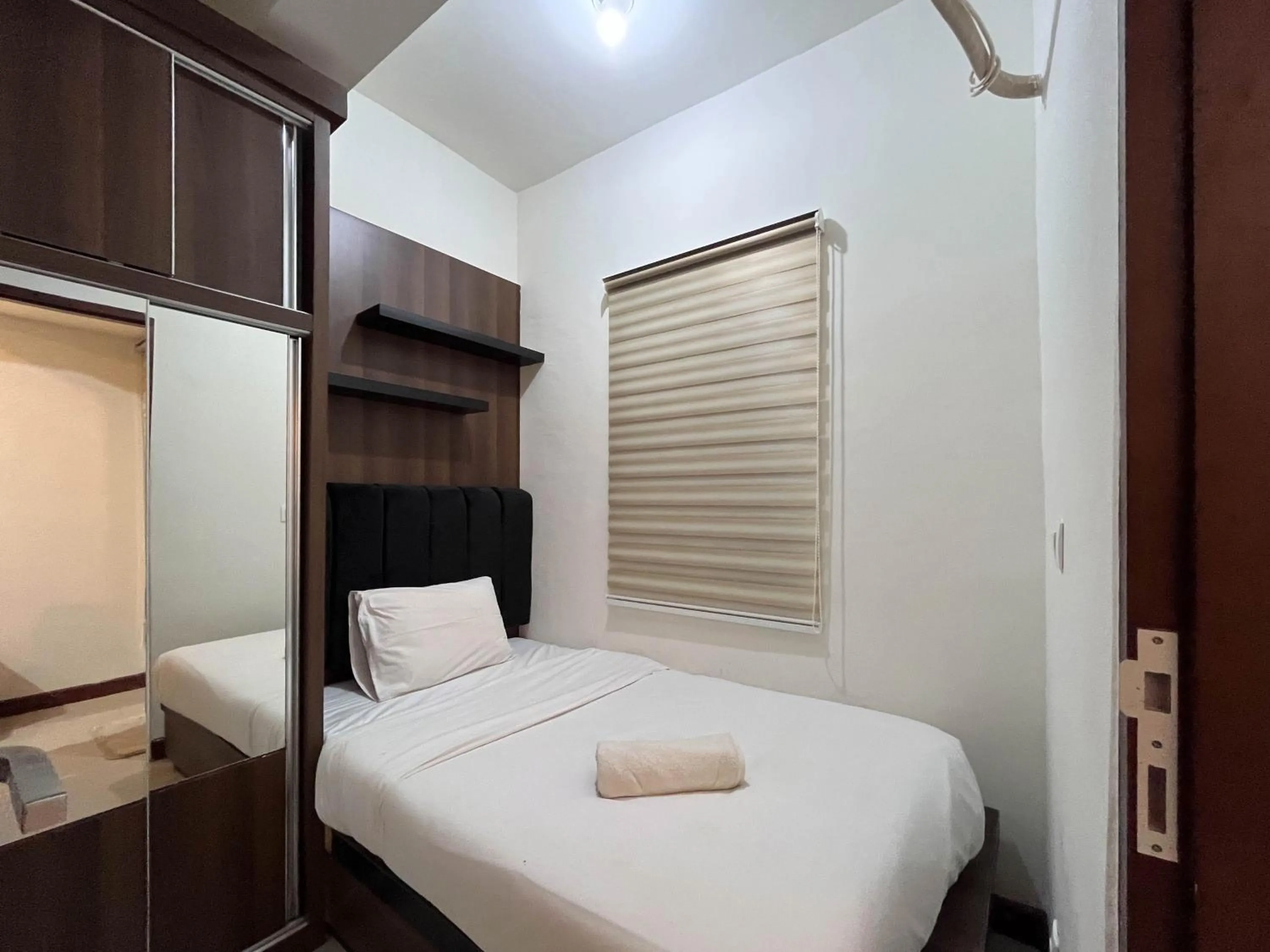 Bed in Warm and Cozy 2BR Vida View Makassar Apartment By Travelio