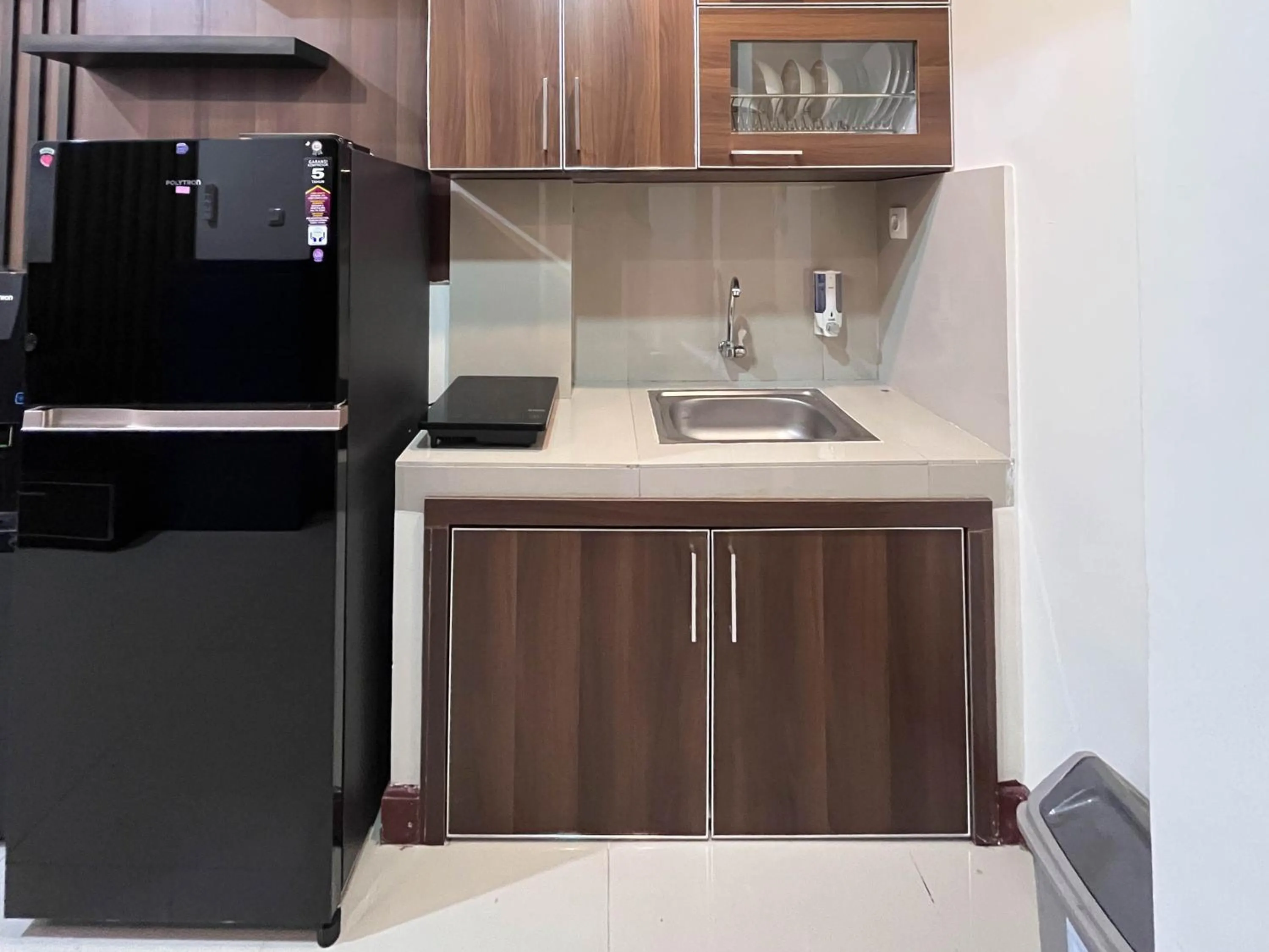 Kitchen or kitchenette in Warm and Cozy 2BR Vida View Makassar Apartment By Travelio