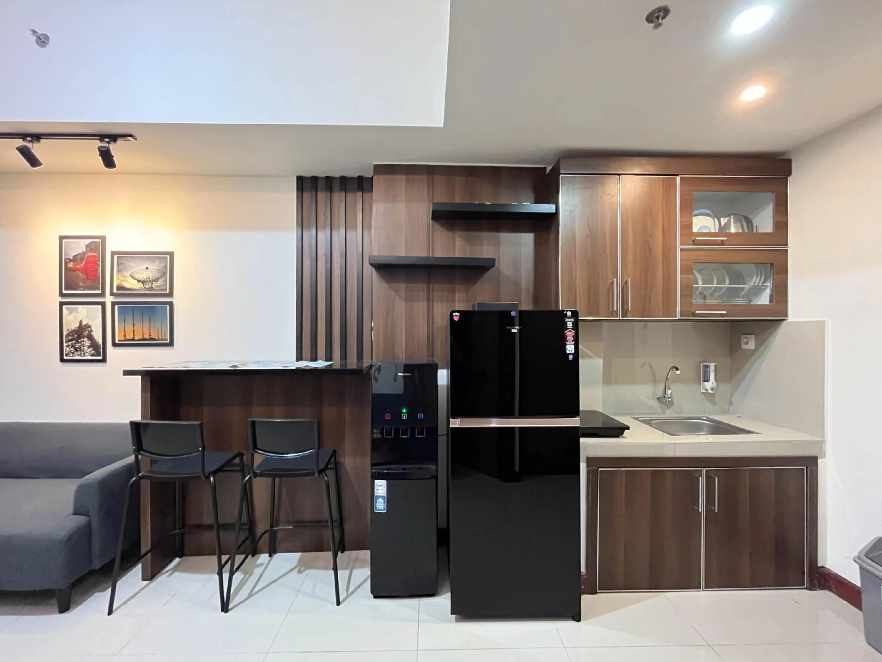 Kitchen or kitchenette in Warm and Cozy 2BR Vida View Makassar Apartment By Travelio