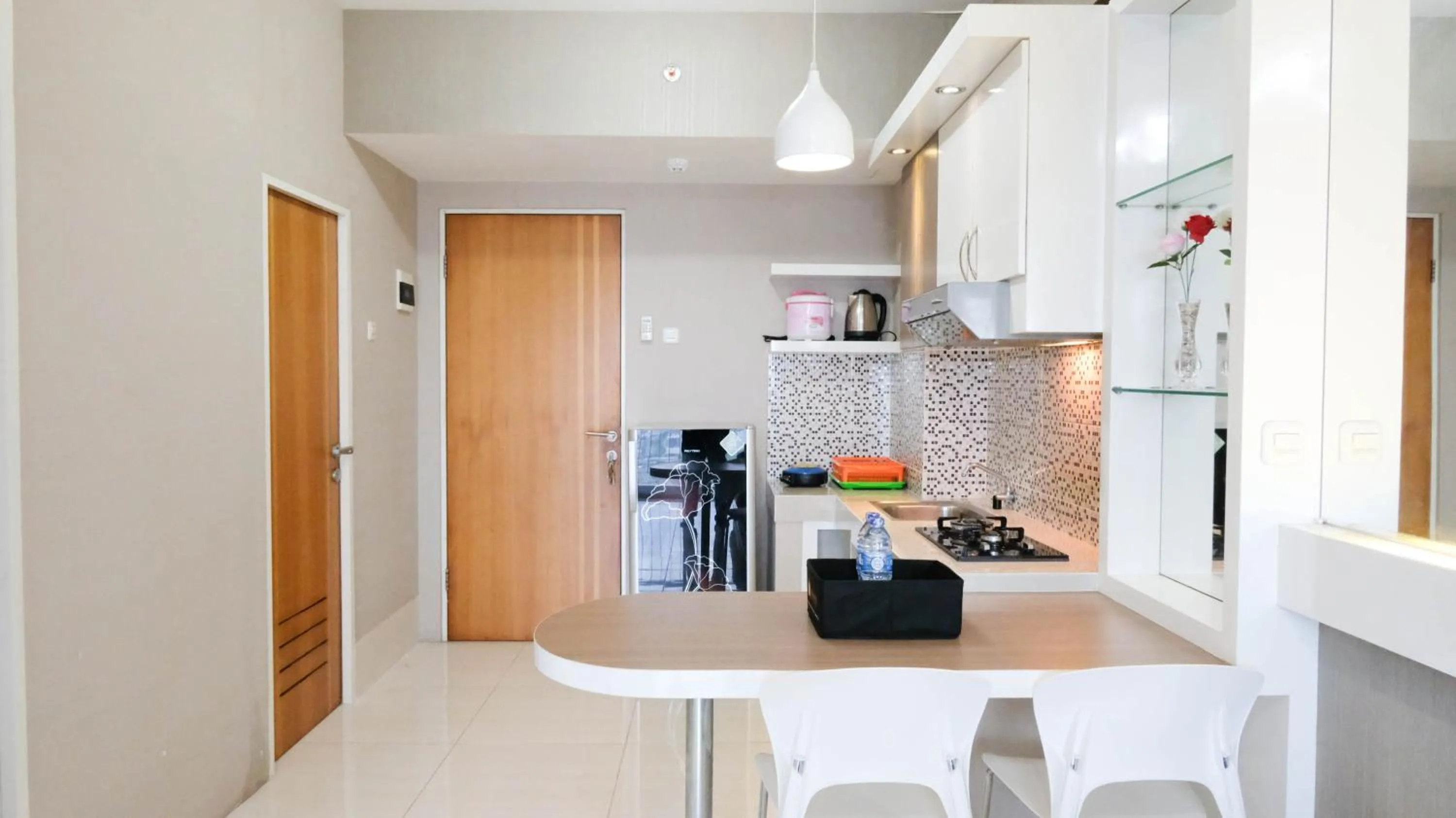 Homey 2BR at Puncak Bukit Golf Surabaya Apartment By Travelio