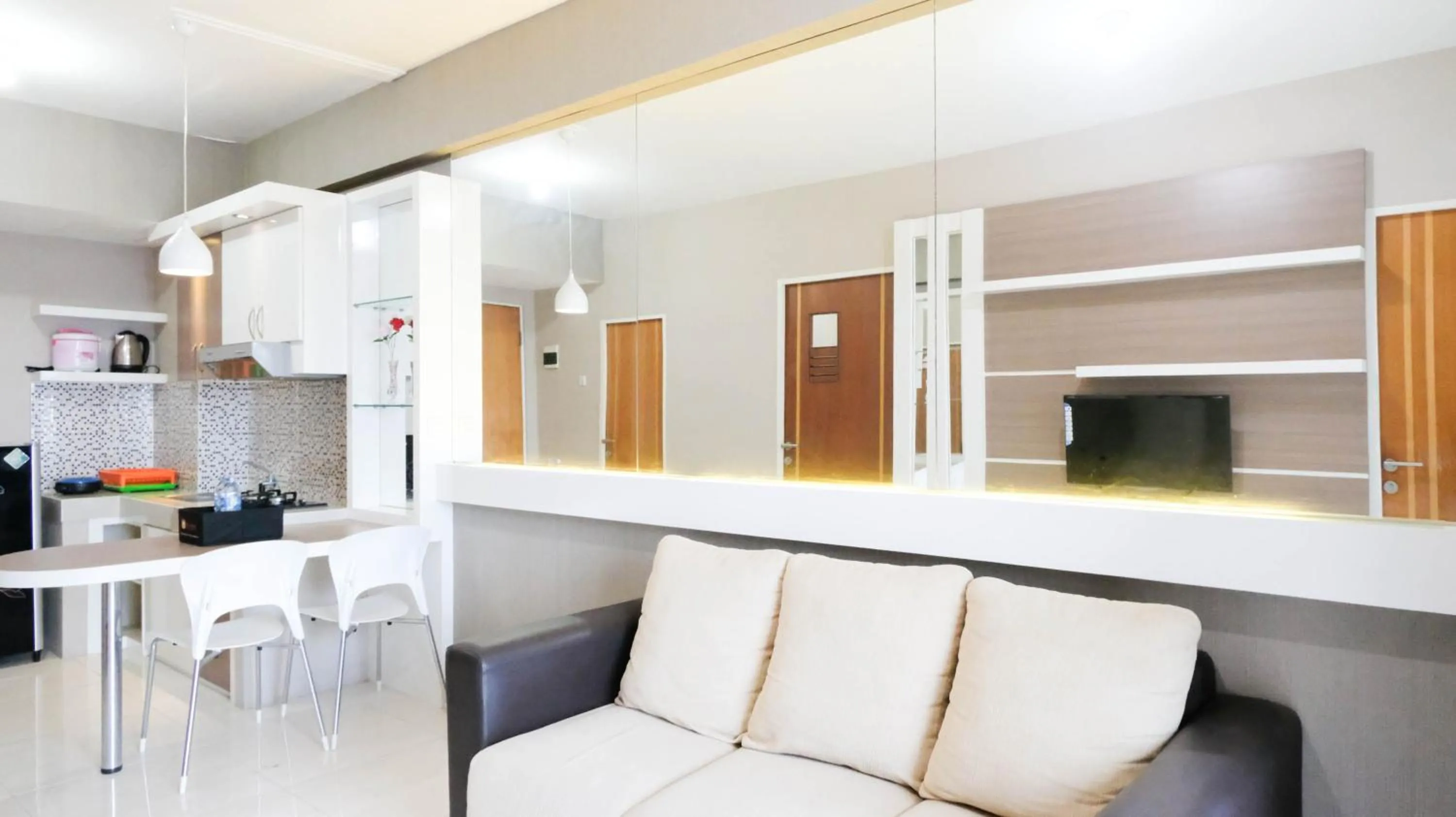 Homey 2BR at Puncak Bukit Golf Surabaya Apartment By Travelio