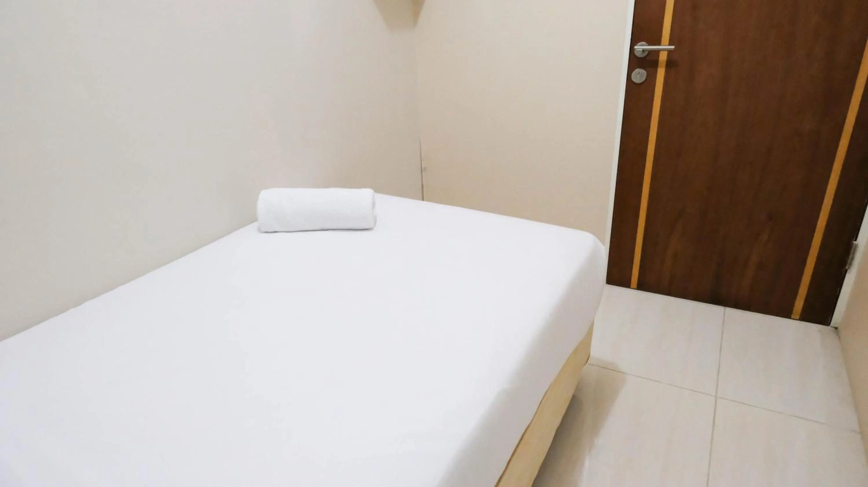 Bedroom, Bed in Homey 2BR at Puncak Bukit Golf Surabaya Apartment By Travelio