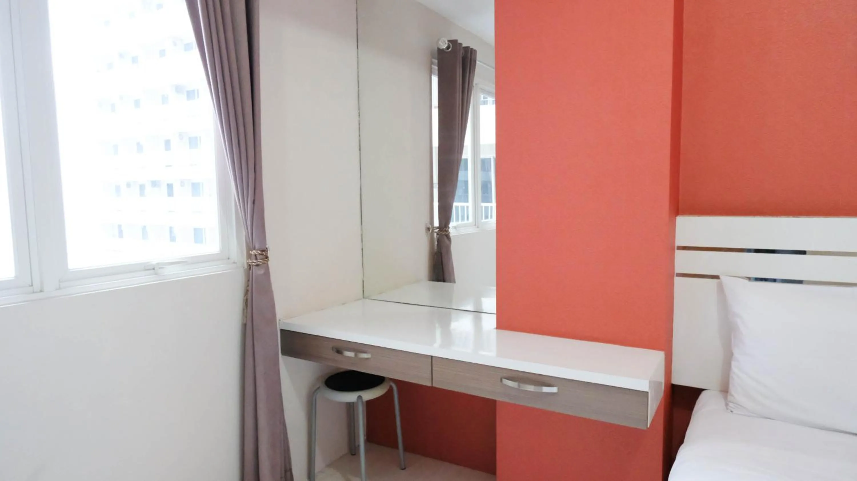 Homey 2BR at Puncak Bukit Golf Surabaya Apartment By Travelio