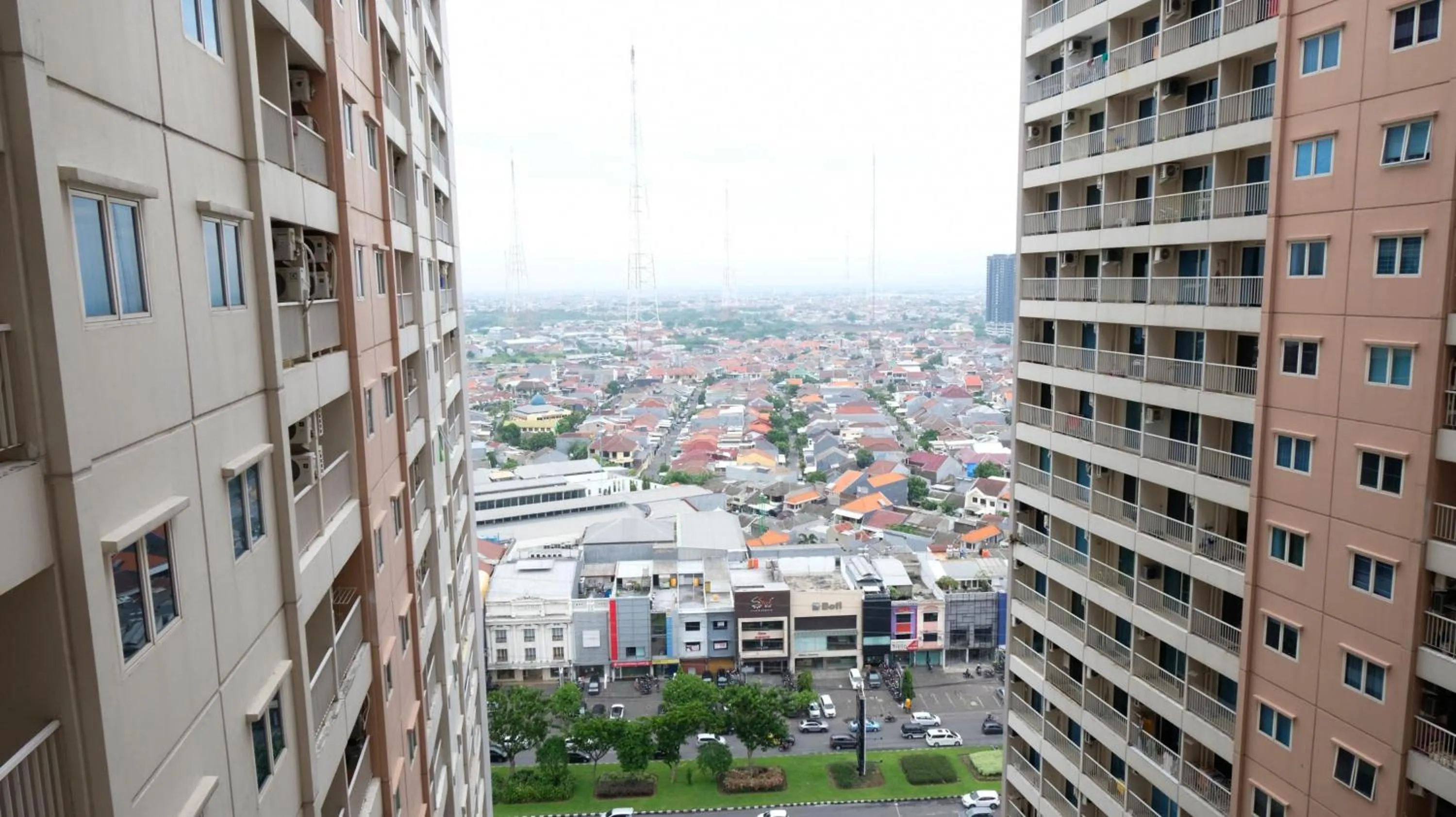 Homey 2BR at Puncak Bukit Golf Surabaya Apartment By Travelio