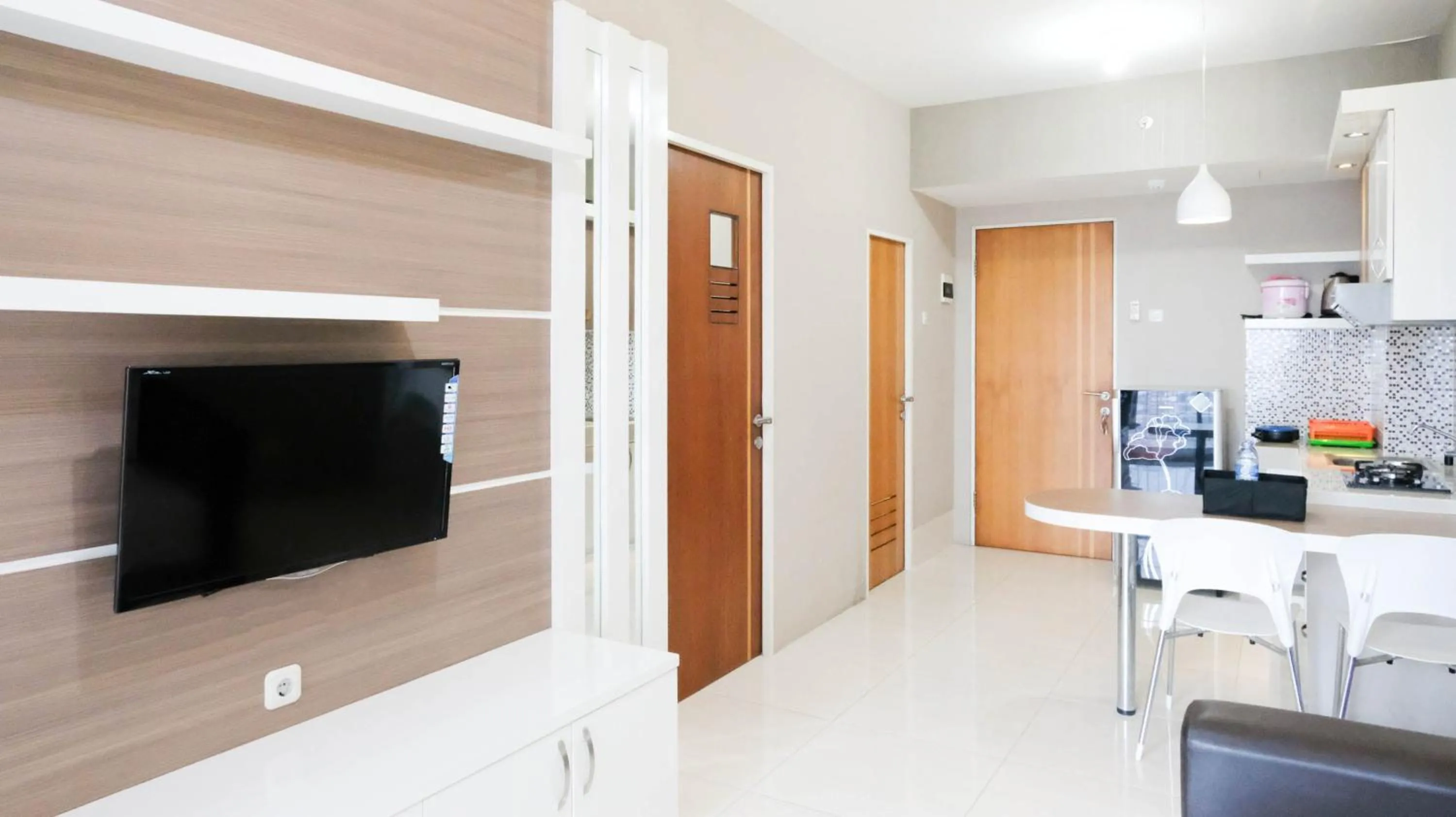 Homey 2BR at Puncak Bukit Golf Surabaya Apartment By Travelio