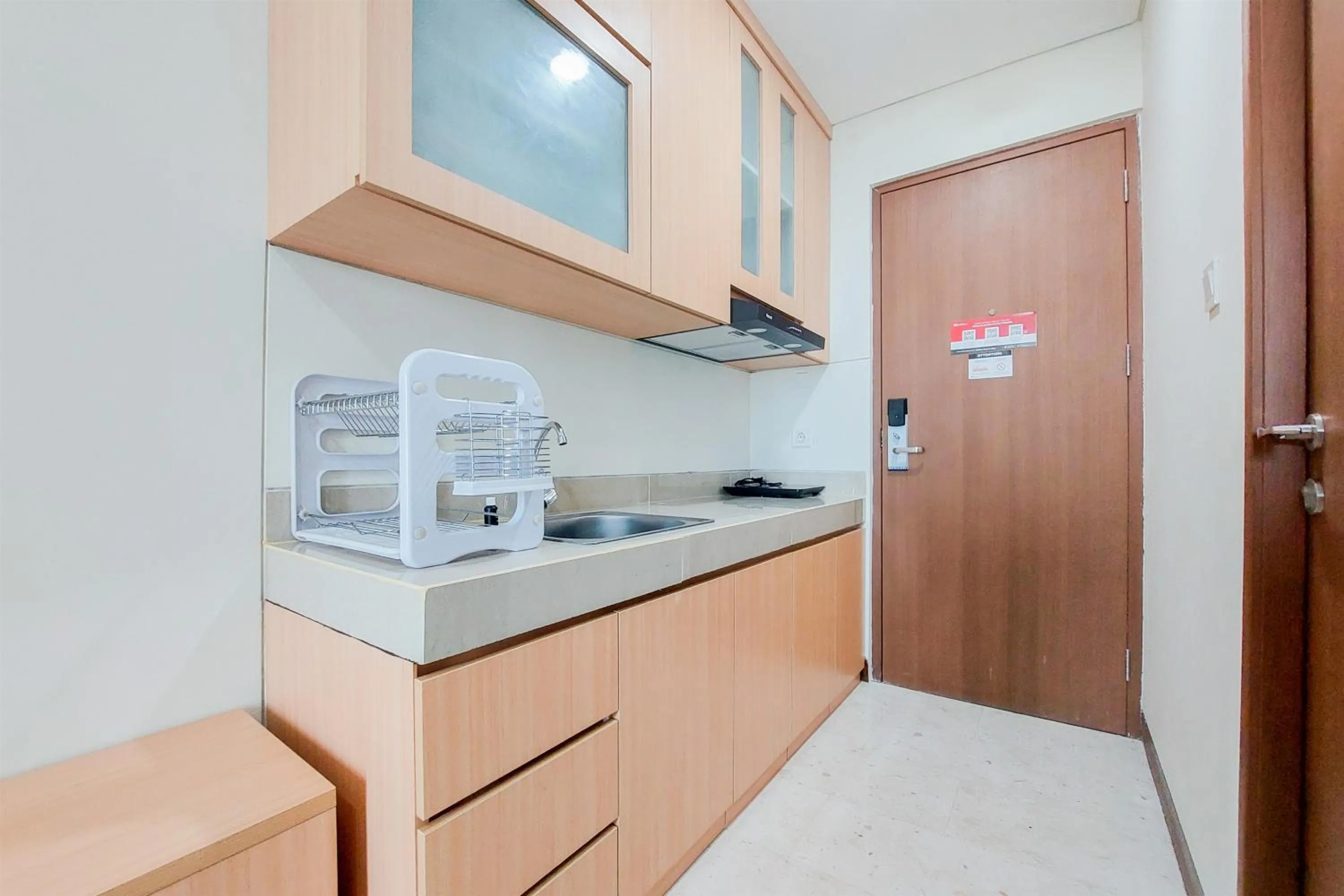 Kitchen or kitchenette in Warm and Simply Look Studio Apartment at B Residence By Travelio