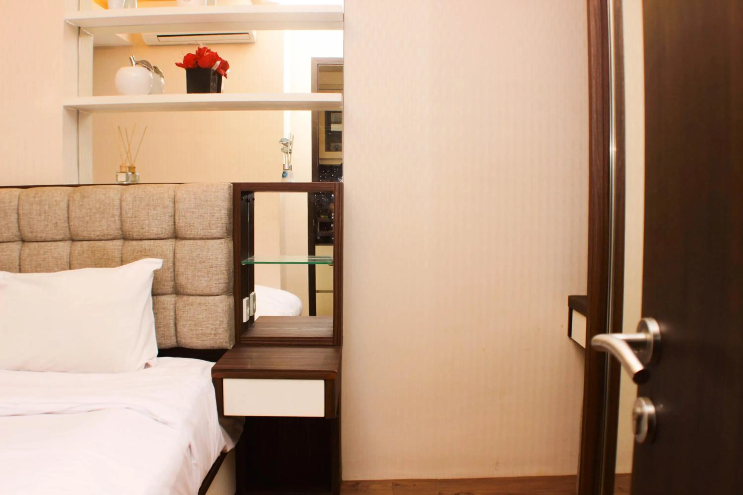 Bed in Strategic and Simply 2BR at Bassura City Apartment By Travelio