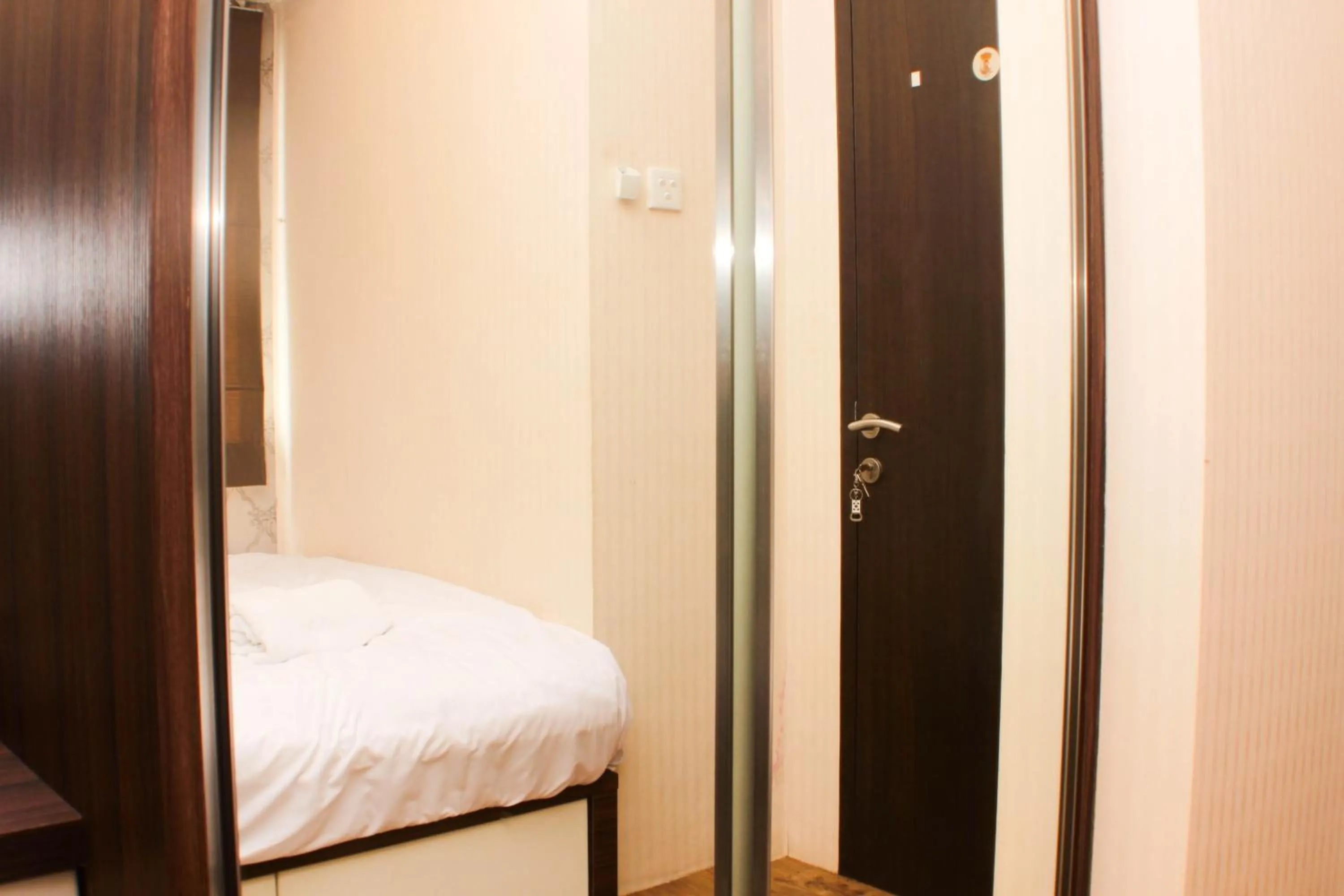 Bed in Strategic and Simply 2BR at Bassura City Apartment By Travelio