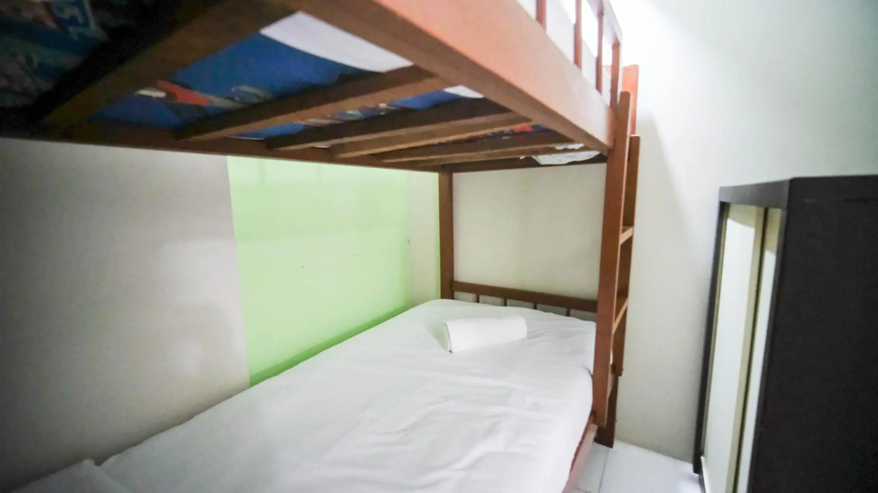 Bed in Homey and Comfy 2BR at Dian Regency Apartment By Travelio Bed in Homey and Comfy 2BR at Dian Regency Apartment By Travelio