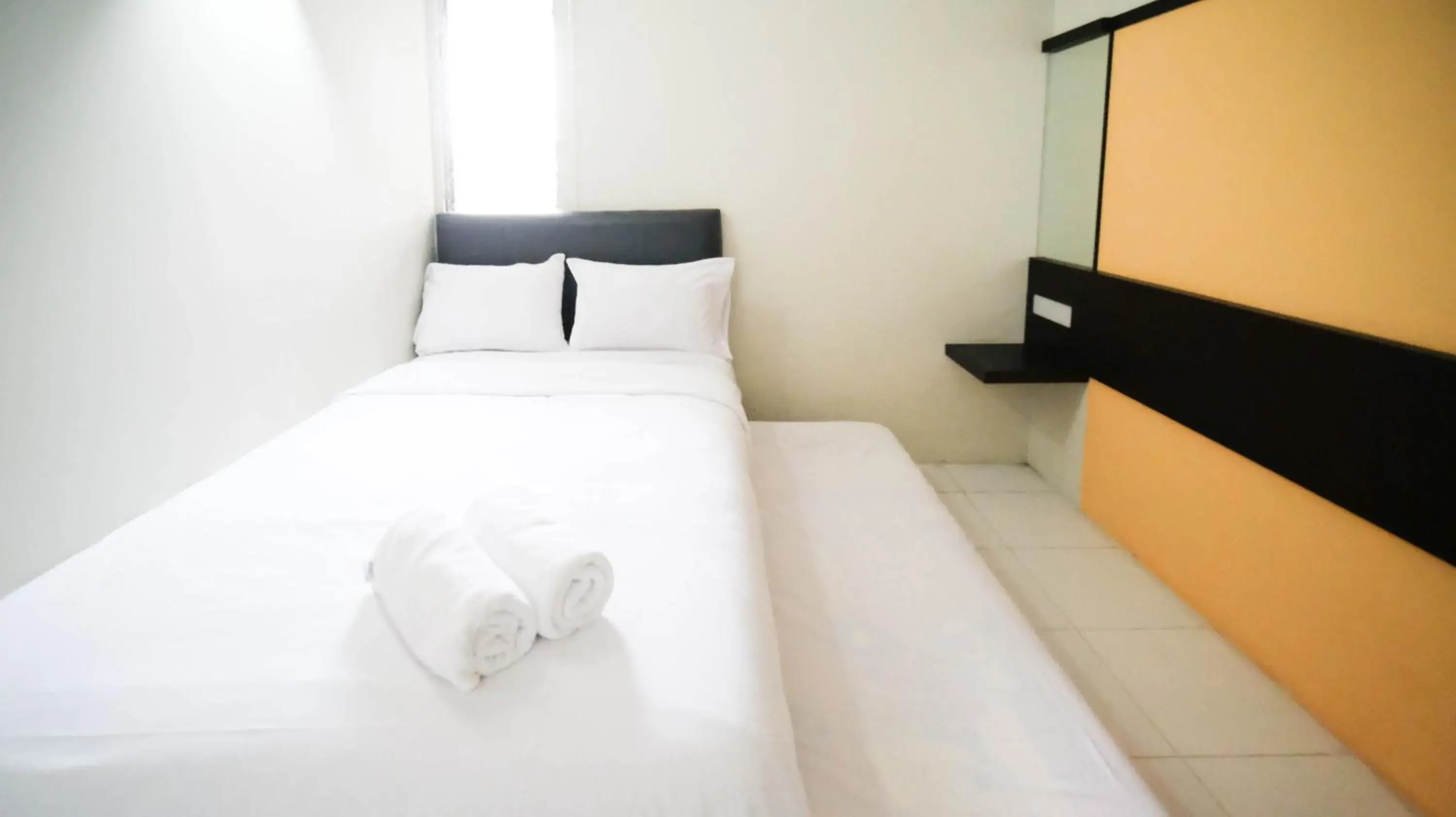 Bed in Homey and Comfy 2BR at Dian Regency Apartment By Travelio Bed in Homey and Comfy 2BR at Dian Regency Apartment By Travelio