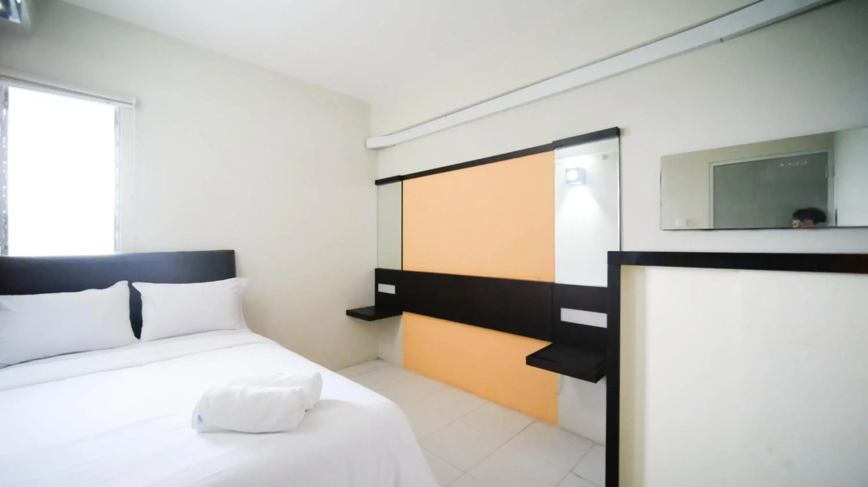 Bed in Homey and Comfy 2BR at Dian Regency Apartment By Travelio Bed in Homey and Comfy 2BR at Dian Regency Apartment By Travelio