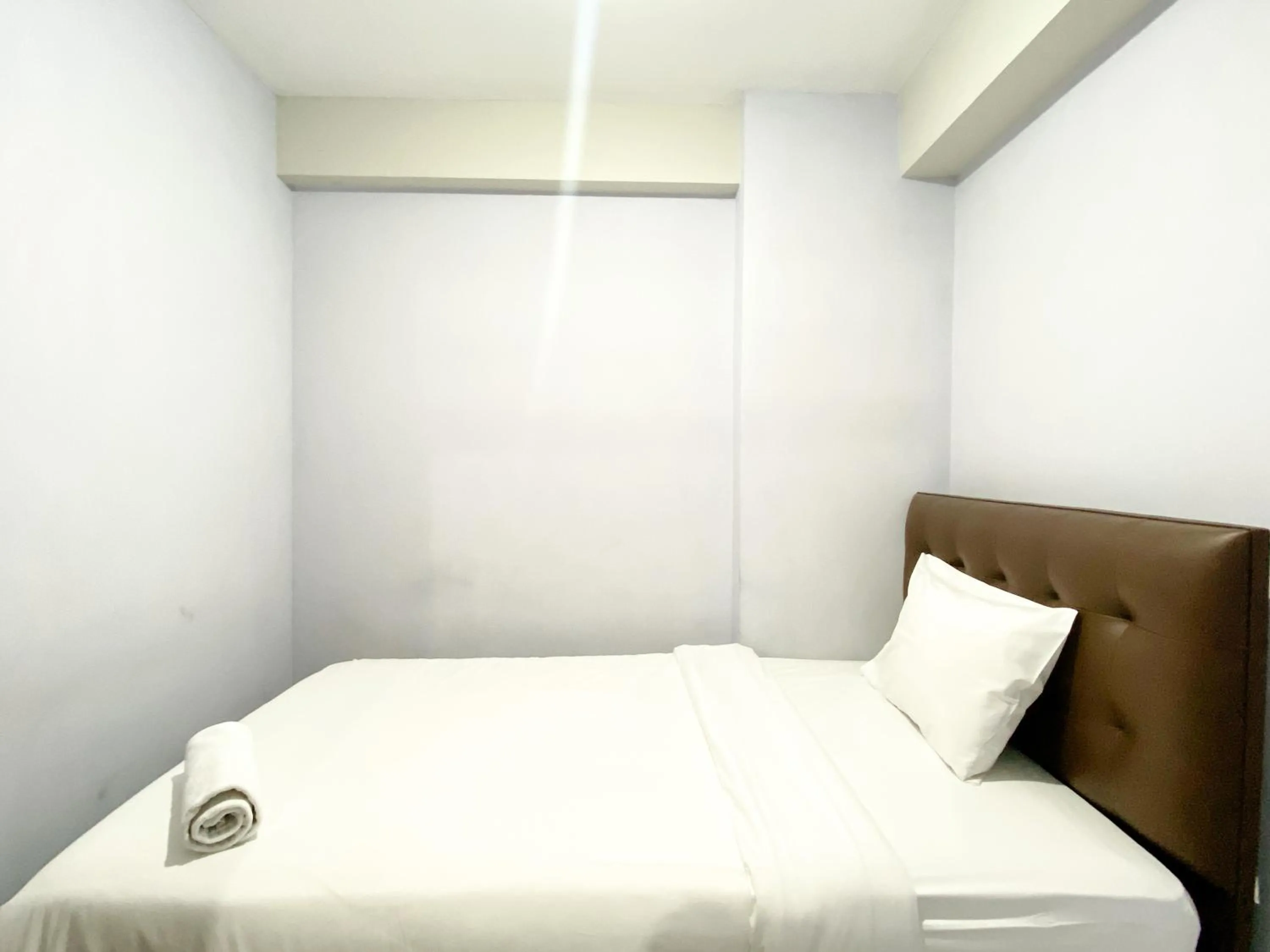 Homey and Cozy Living 2BR Lagoon Bekasi Town Square Apartment By Travelio