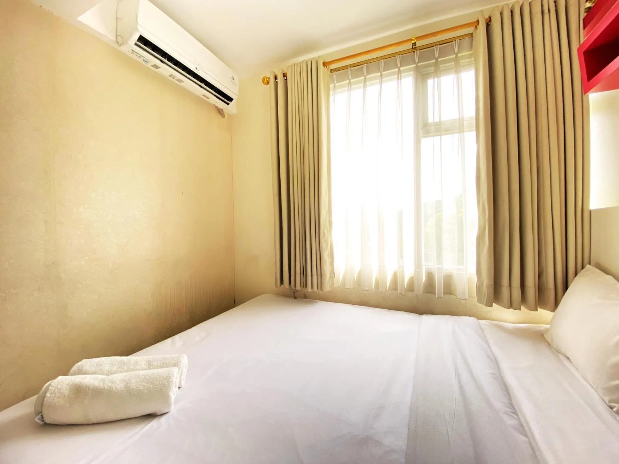 Bed in Spacious 2BR at Jarrdin Cihampelas Apartment By Travelio