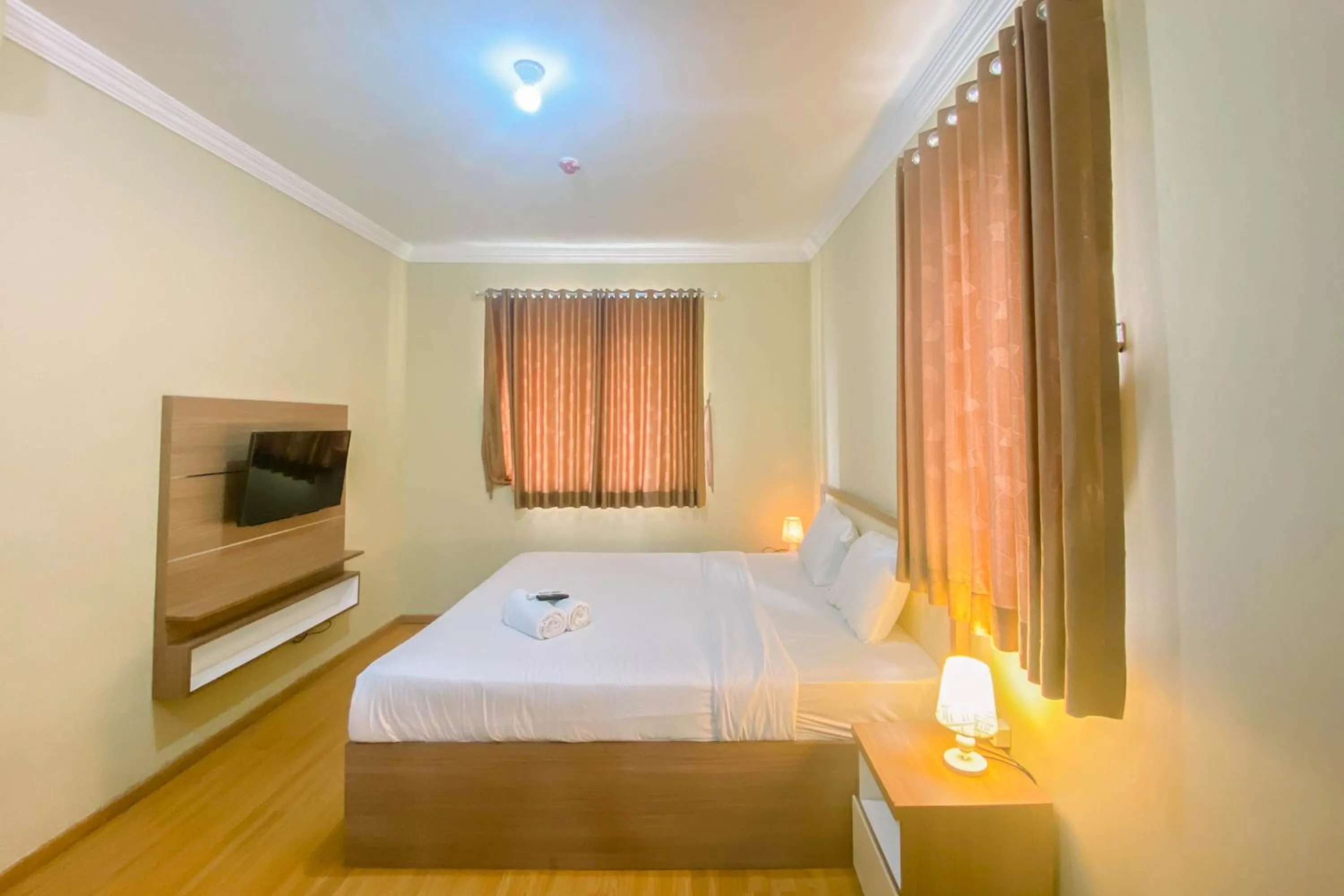 Bed in Relaxing 2BR at Grand Palace Kemayoran Apartment By Travelio