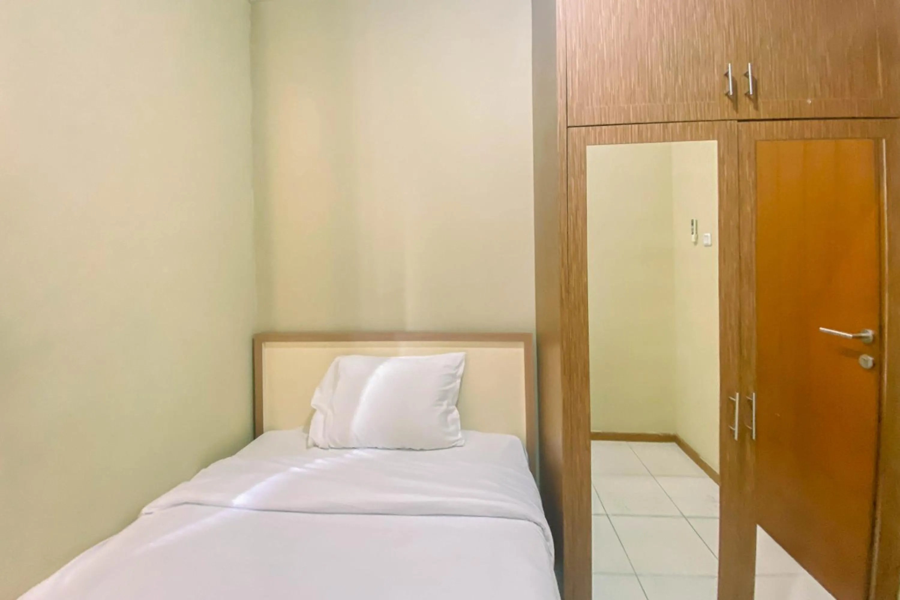 Bed in Relaxing 2BR at Grand Palace Kemayoran Apartment By Travelio