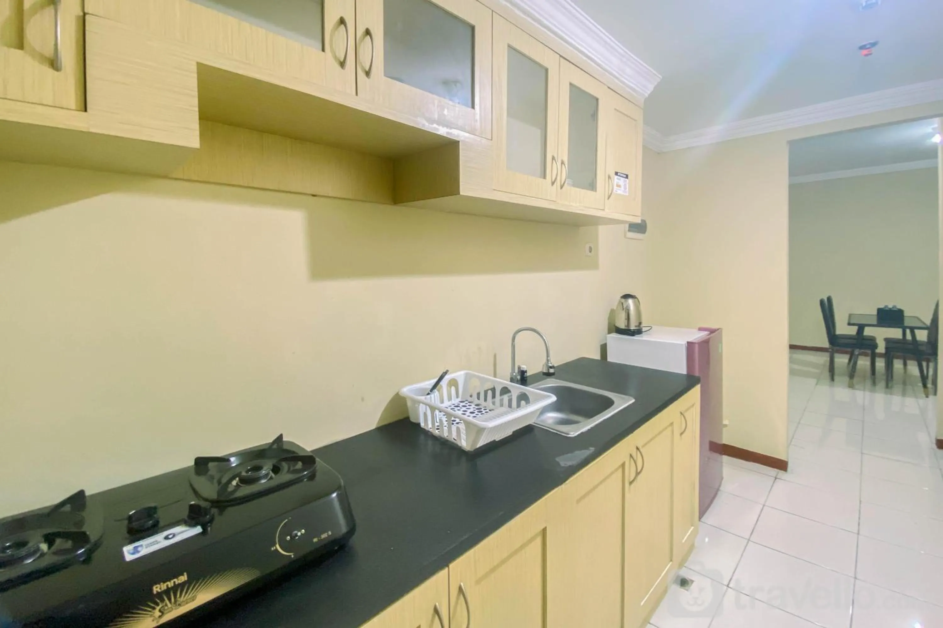 Kitchen or kitchenette in Relaxing 2BR at Grand Palace Kemayoran Apartment By Travelio