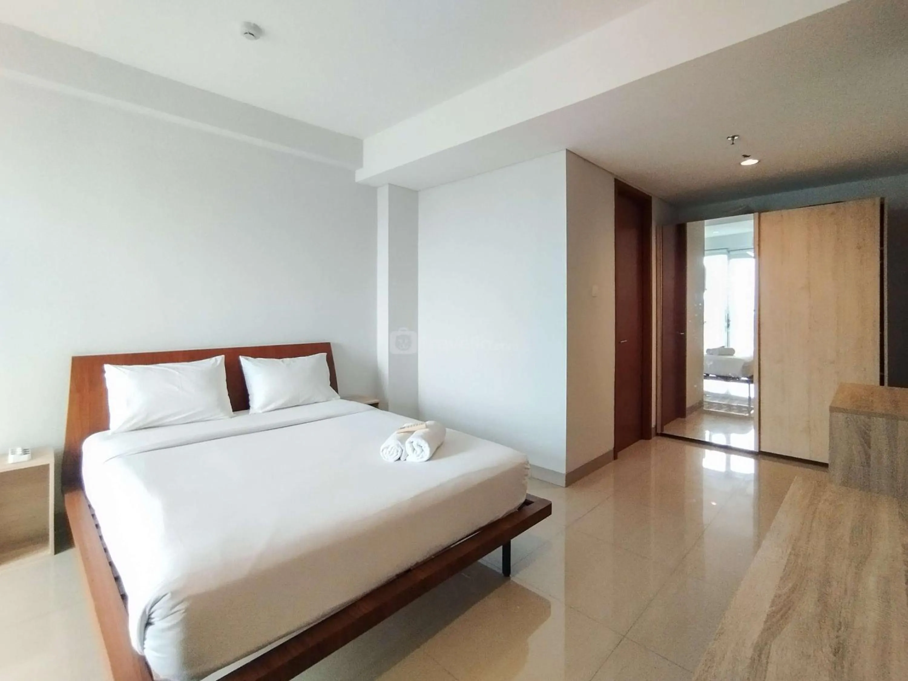 Bed in Tranquil Designed 2BR Apartment Dago Suites By Travelio