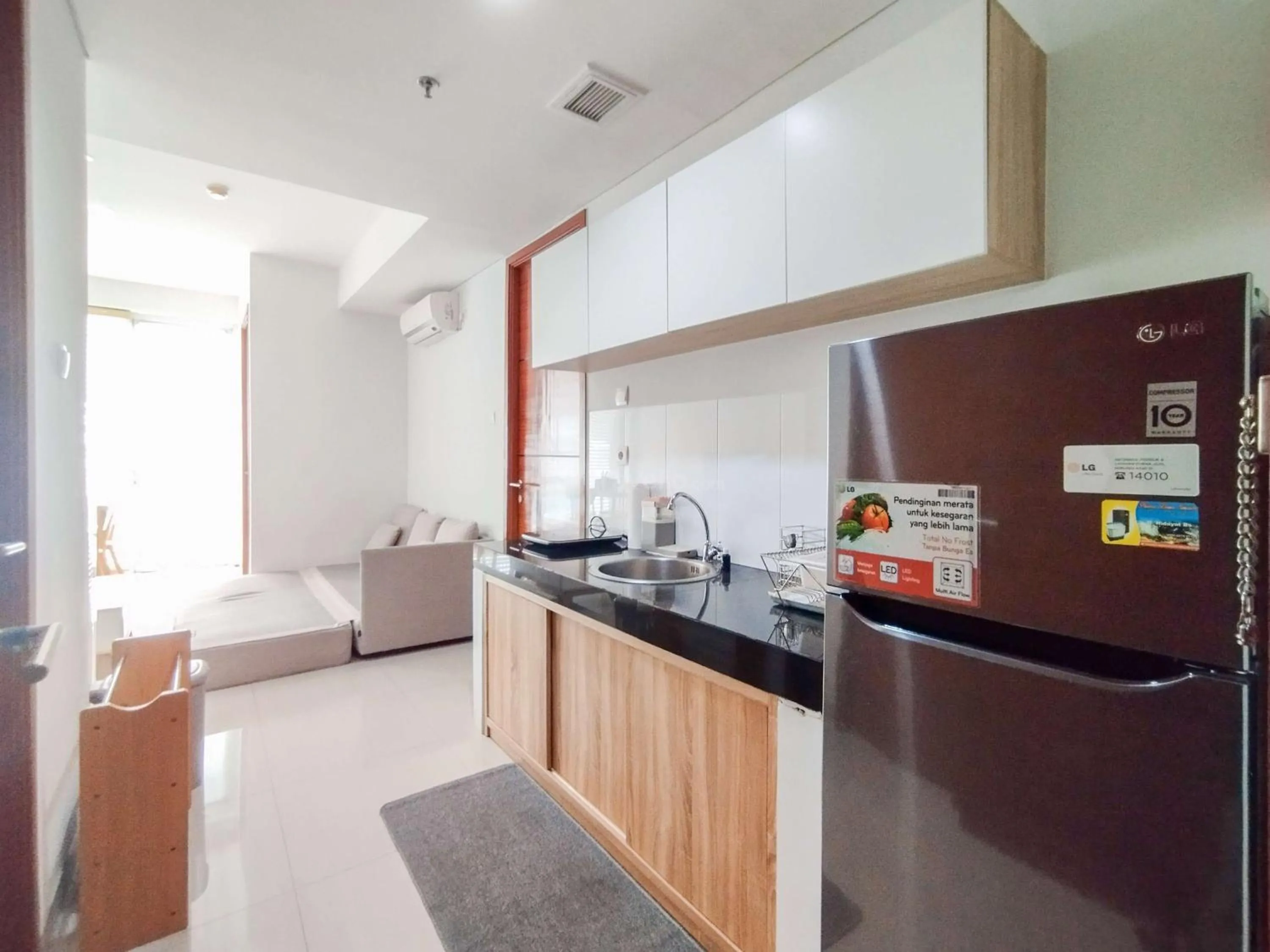 Bed in Tranquil Designed 2BR Apartment Dago Suites By Travelio