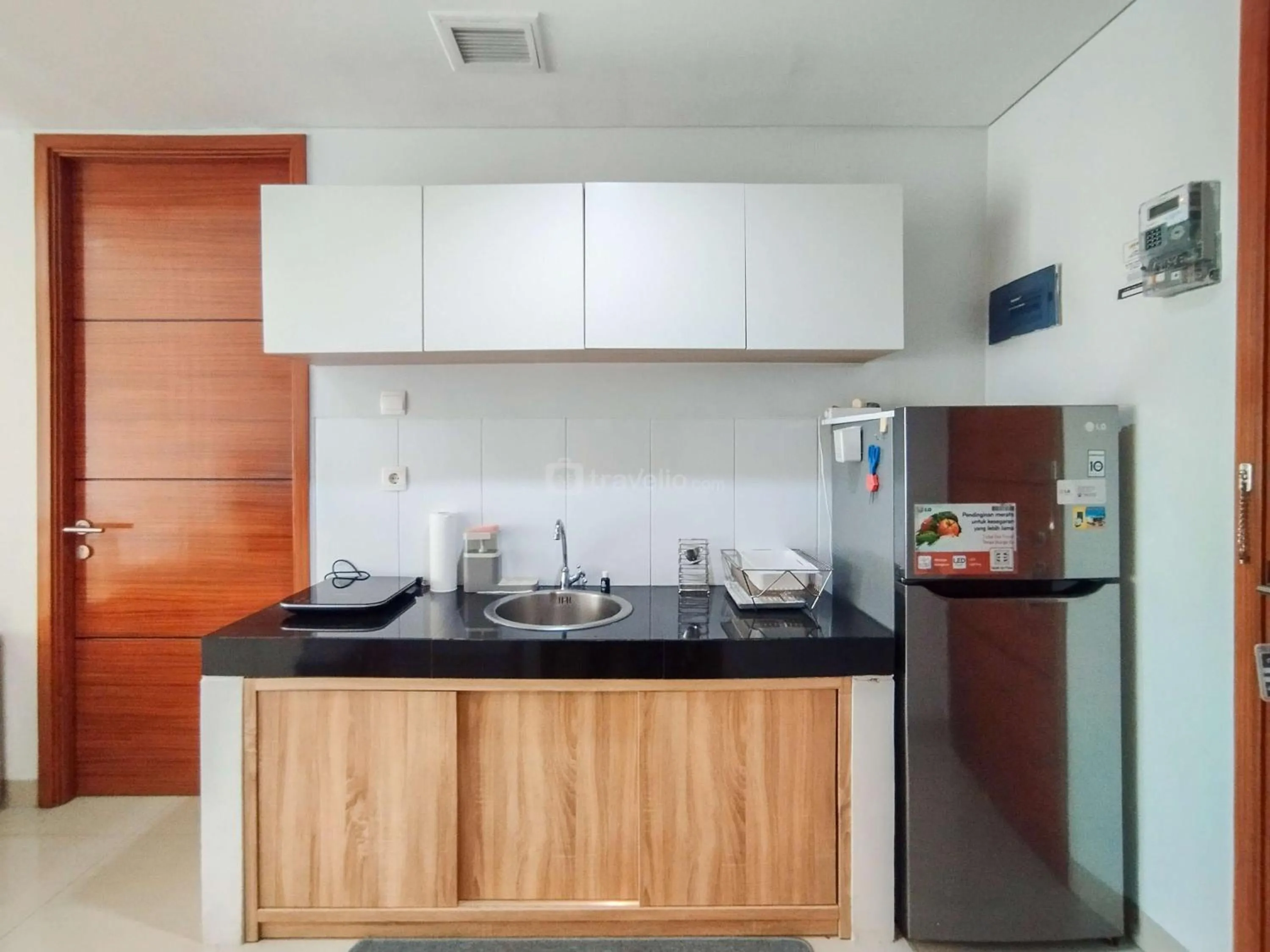 Bed in Tranquil Designed 2BR Apartment Dago Suites By Travelio