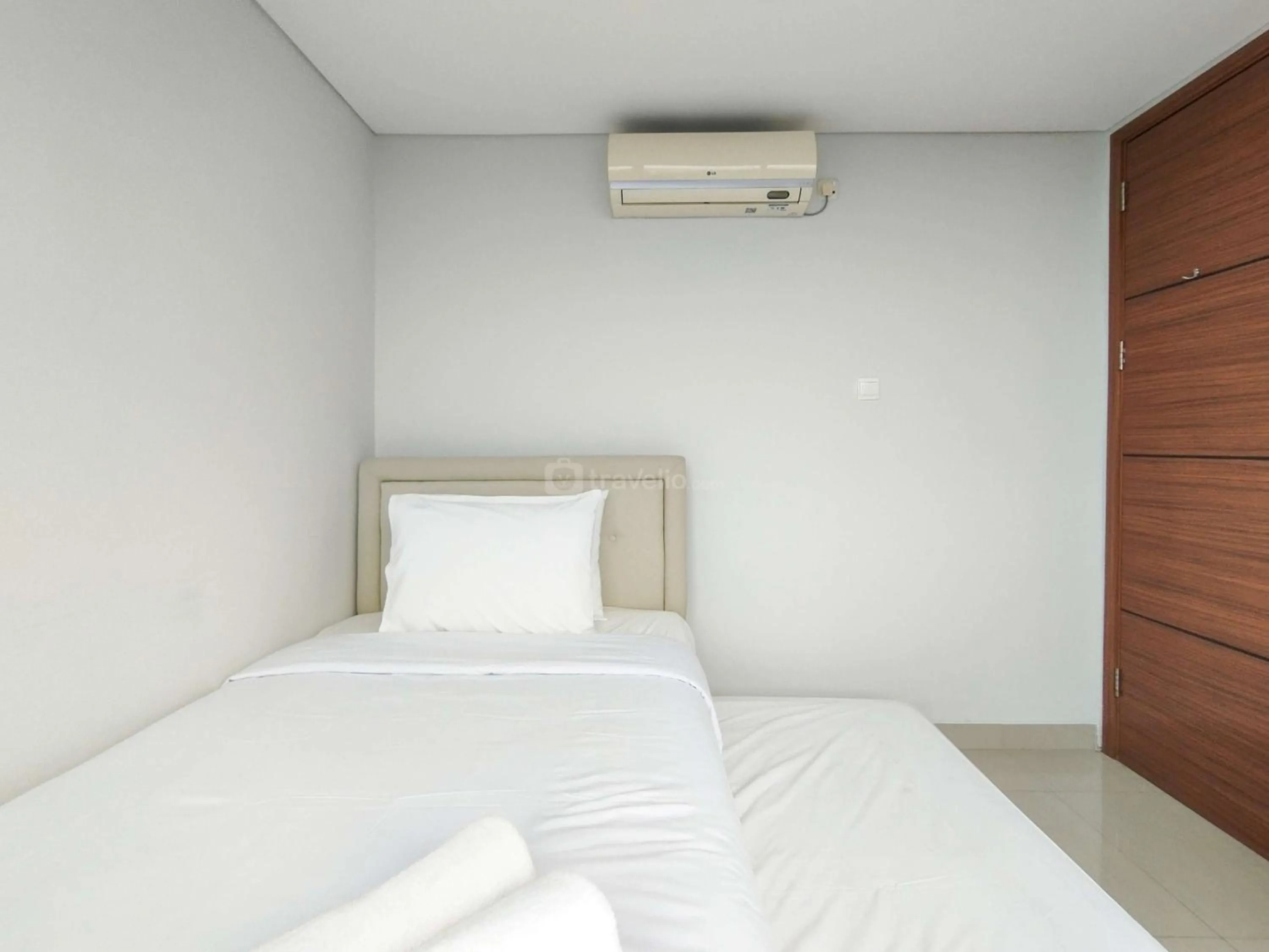 Bed in Tranquil Designed 2BR Apartment Dago Suites By Travelio