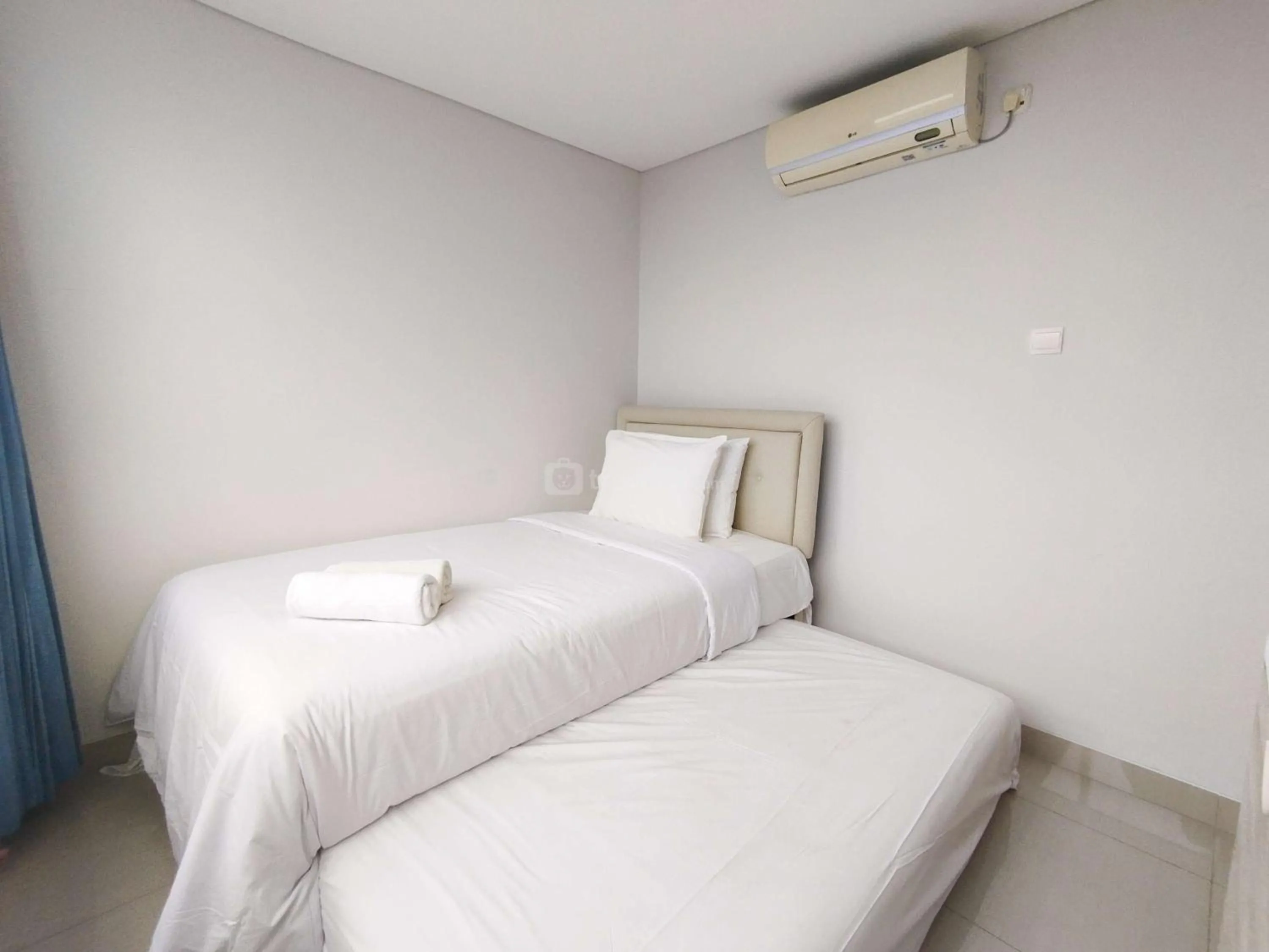 Bed in Tranquil Designed 2BR Apartment Dago Suites By Travelio