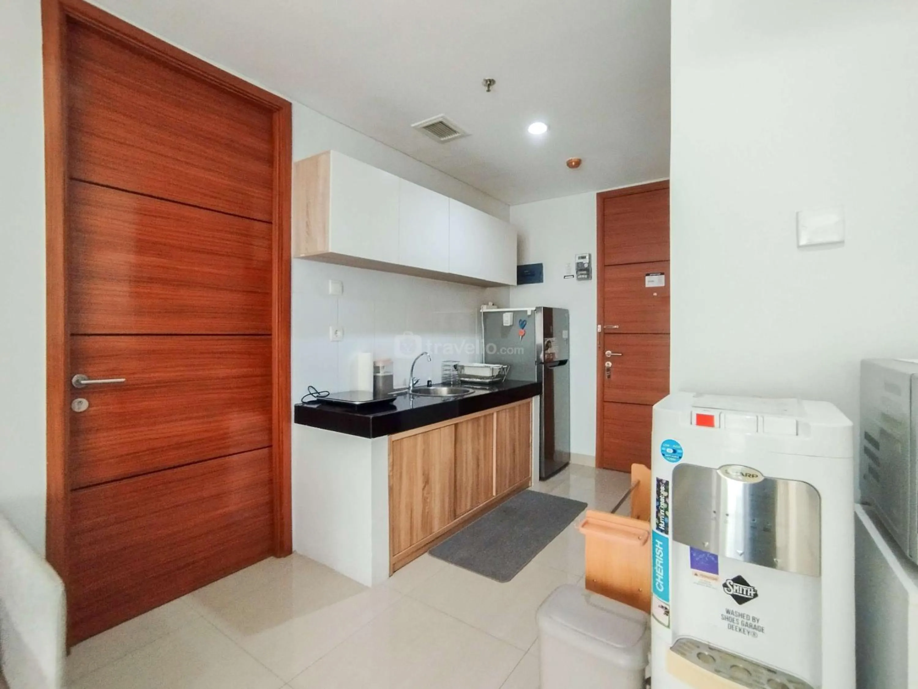 Bed in Tranquil Designed 2BR Apartment Dago Suites By Travelio