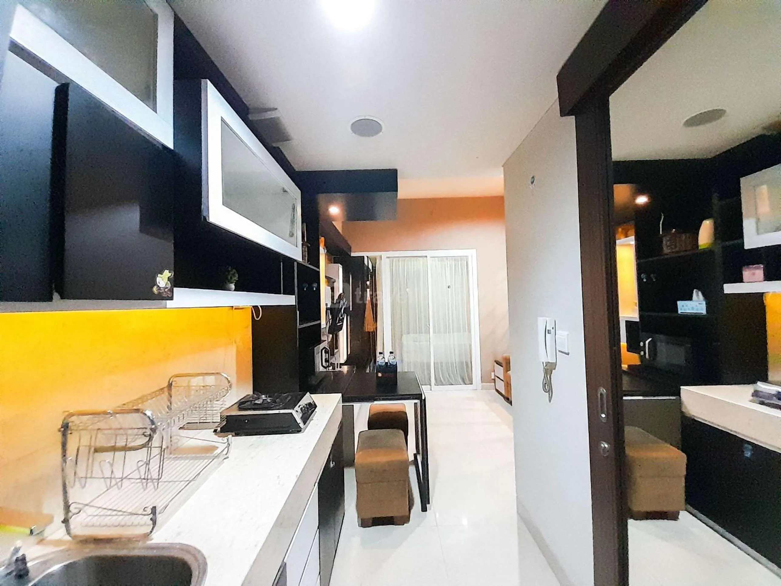Brand New and Good Simply 1BR at Uttara The Icon Apartment By Travelio